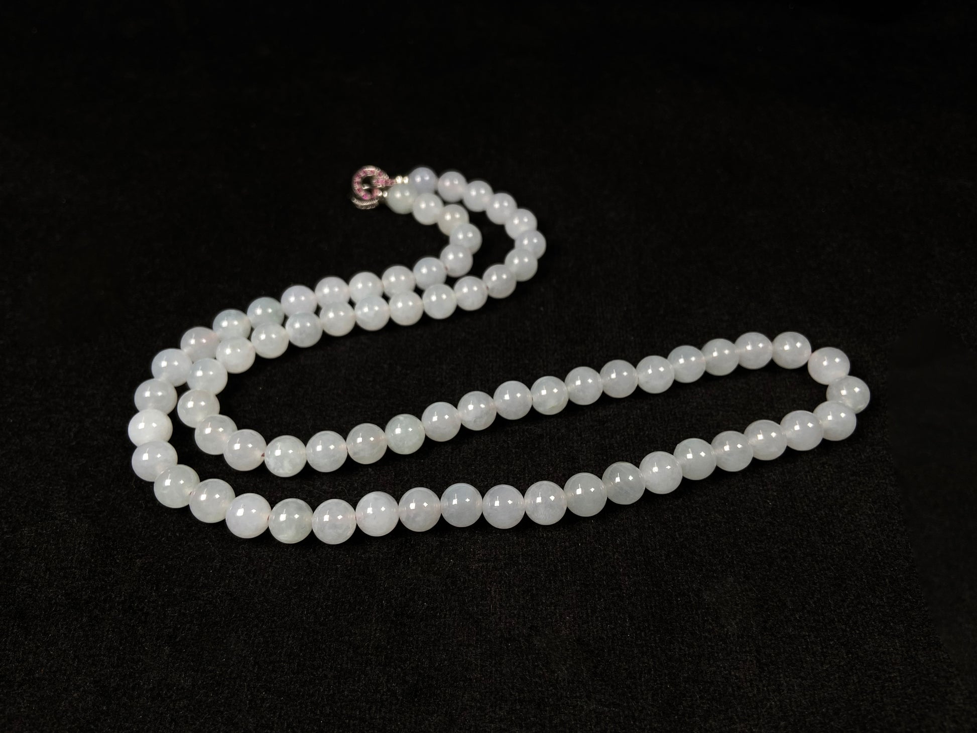 This elegant jadeite bead necklace features white semi-transparent beads.