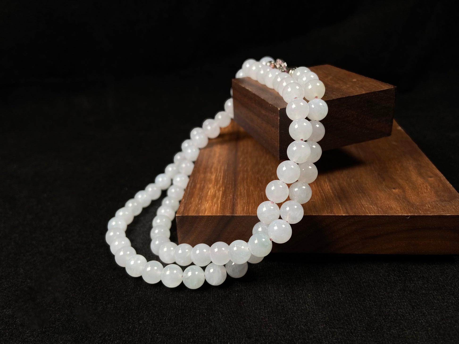 This elegant jadeite bead necklace features white semi-transparent beads.
