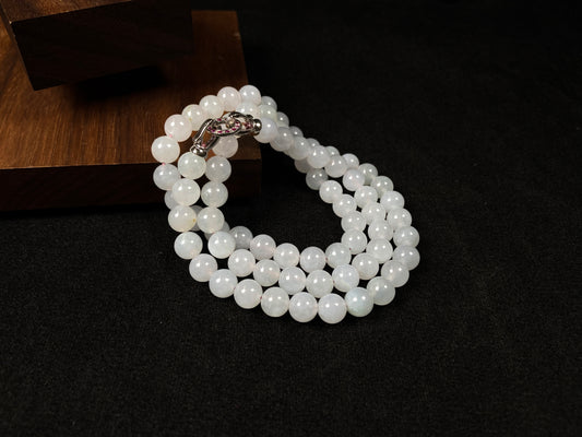 This elegant jadeite bead necklace features white semi-transparent beads.