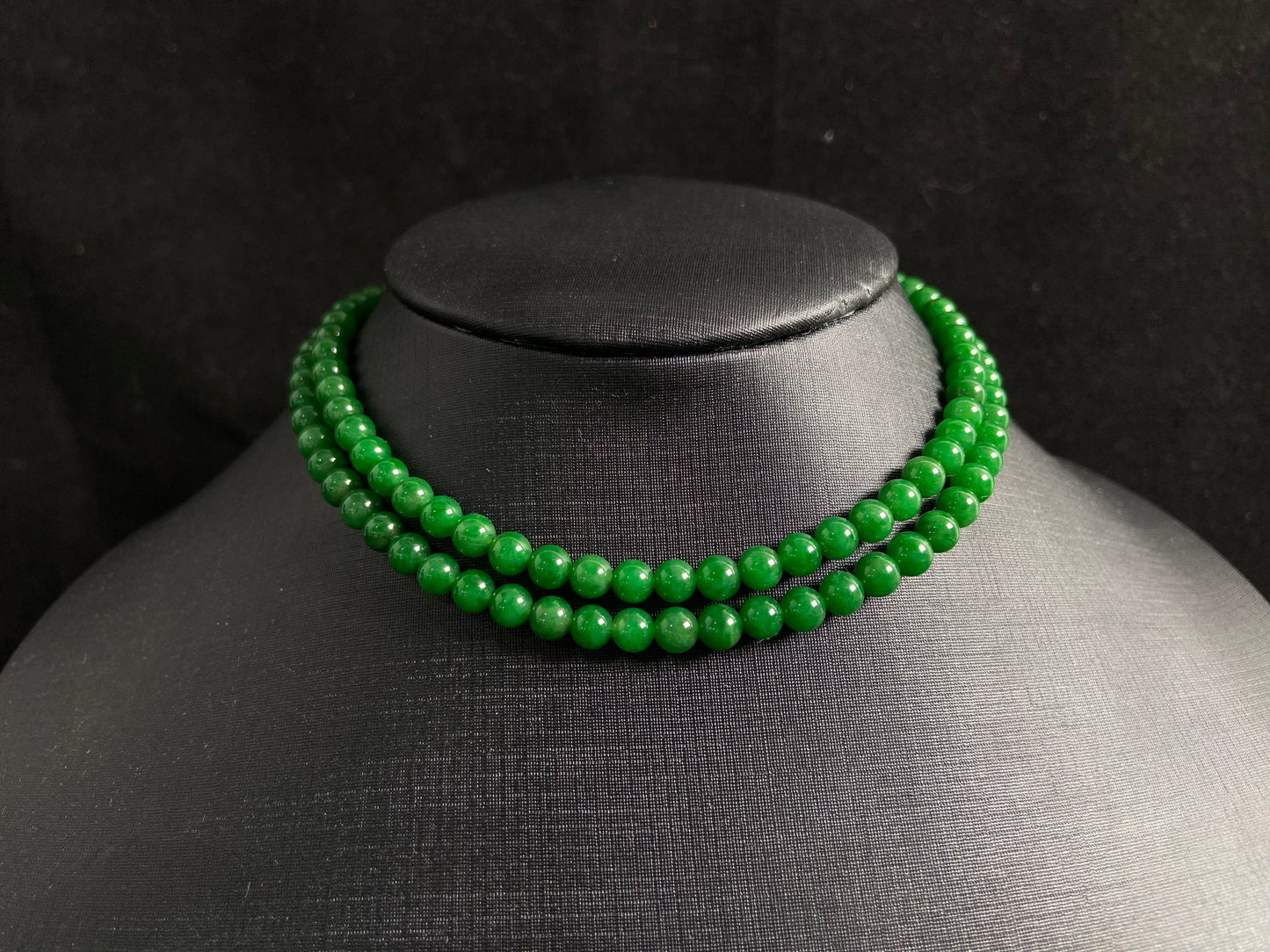 This necklace features imperial green jade beads of exceptional quality and vibrant color.