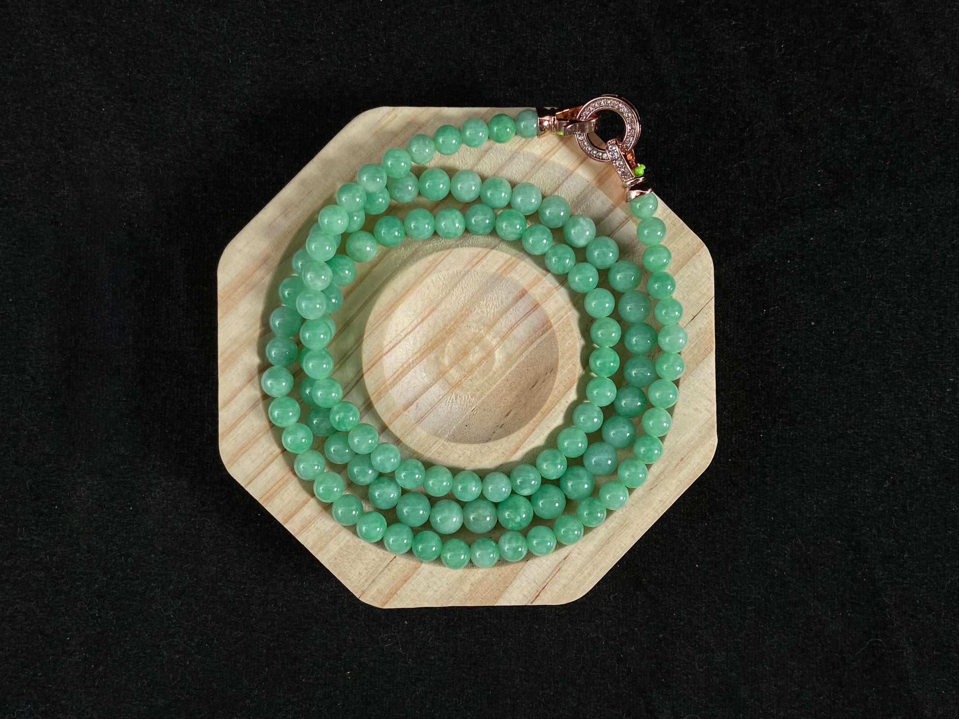 A jade bead strand composed entirely of small apple green beads.