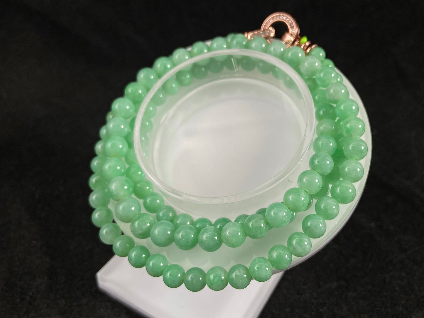 A jade bead strand composed entirely of small apple green beads.