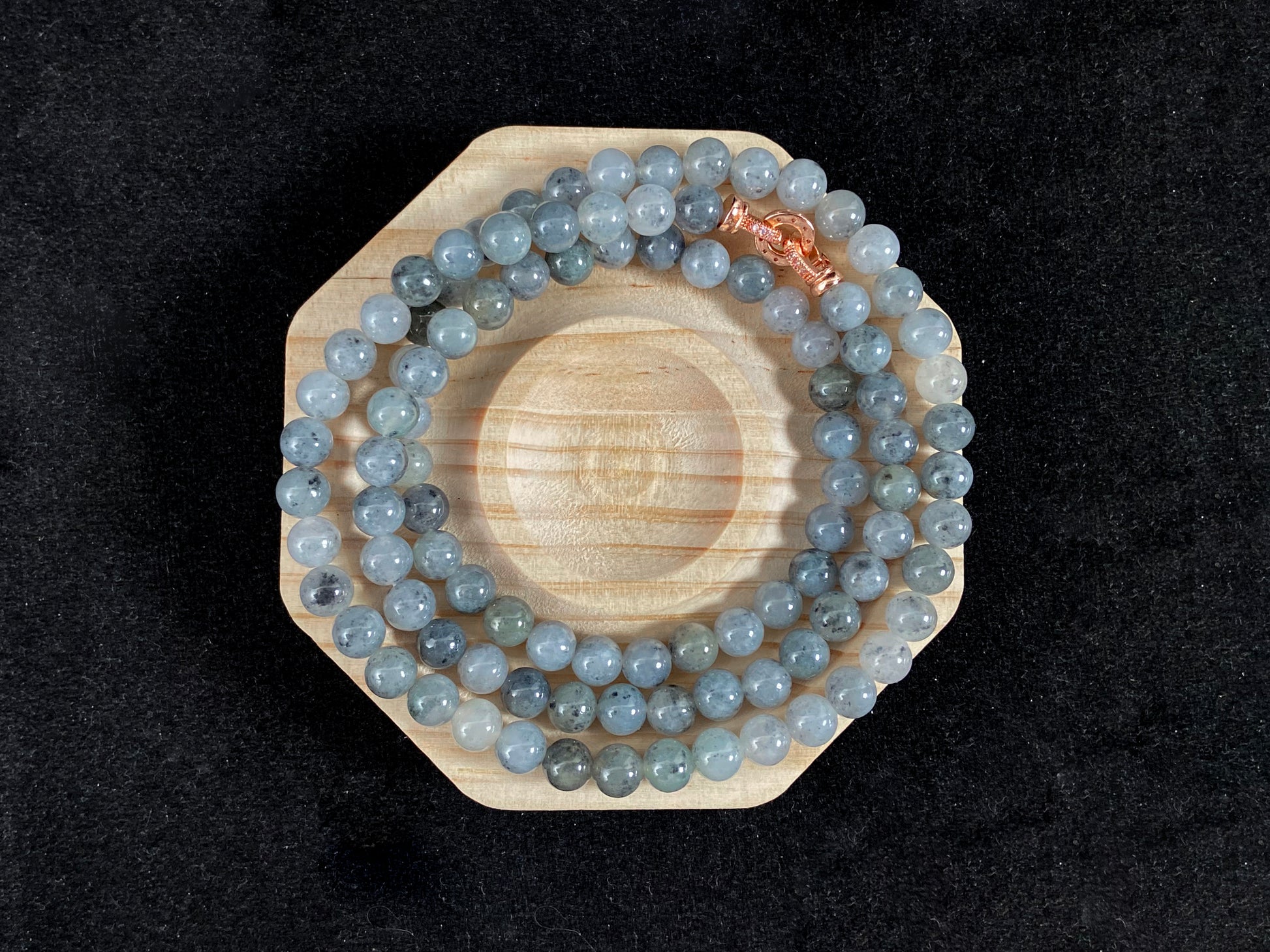A jade bead strand composed of small pale gray beads.