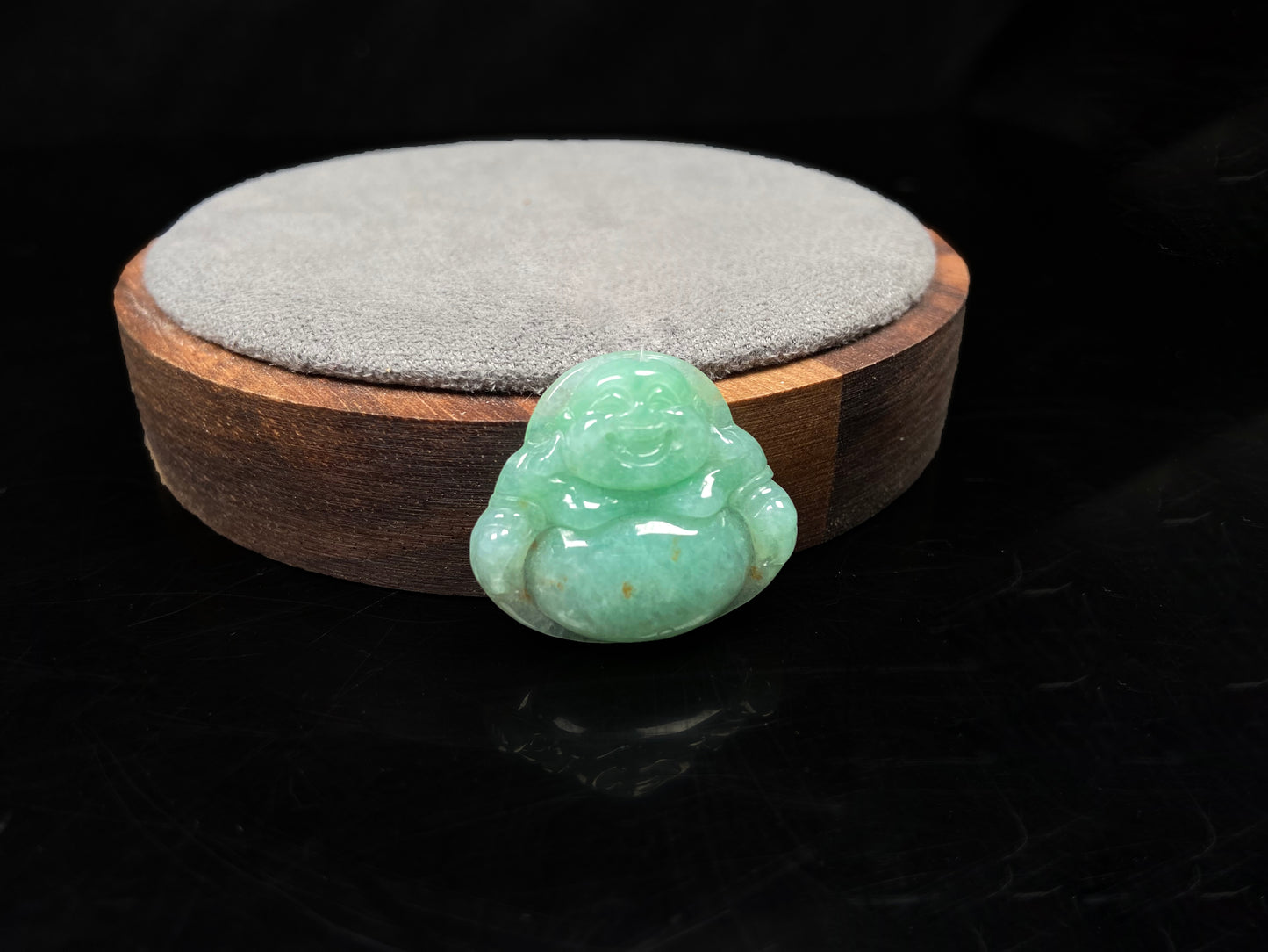 A apple green Maitreya Buddha loose jadeite group.