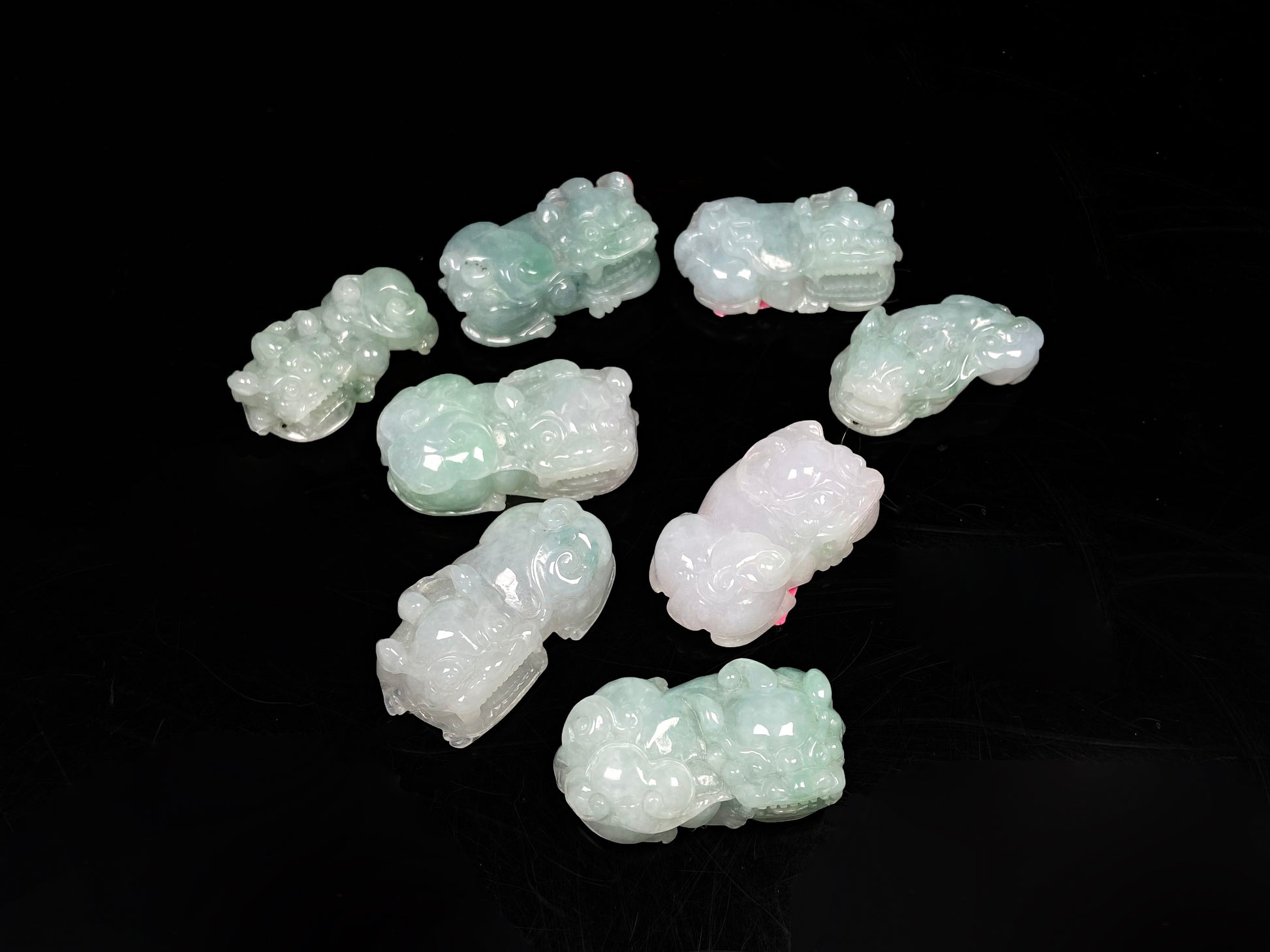A white green Overlord Pixiu loose jadeite group.