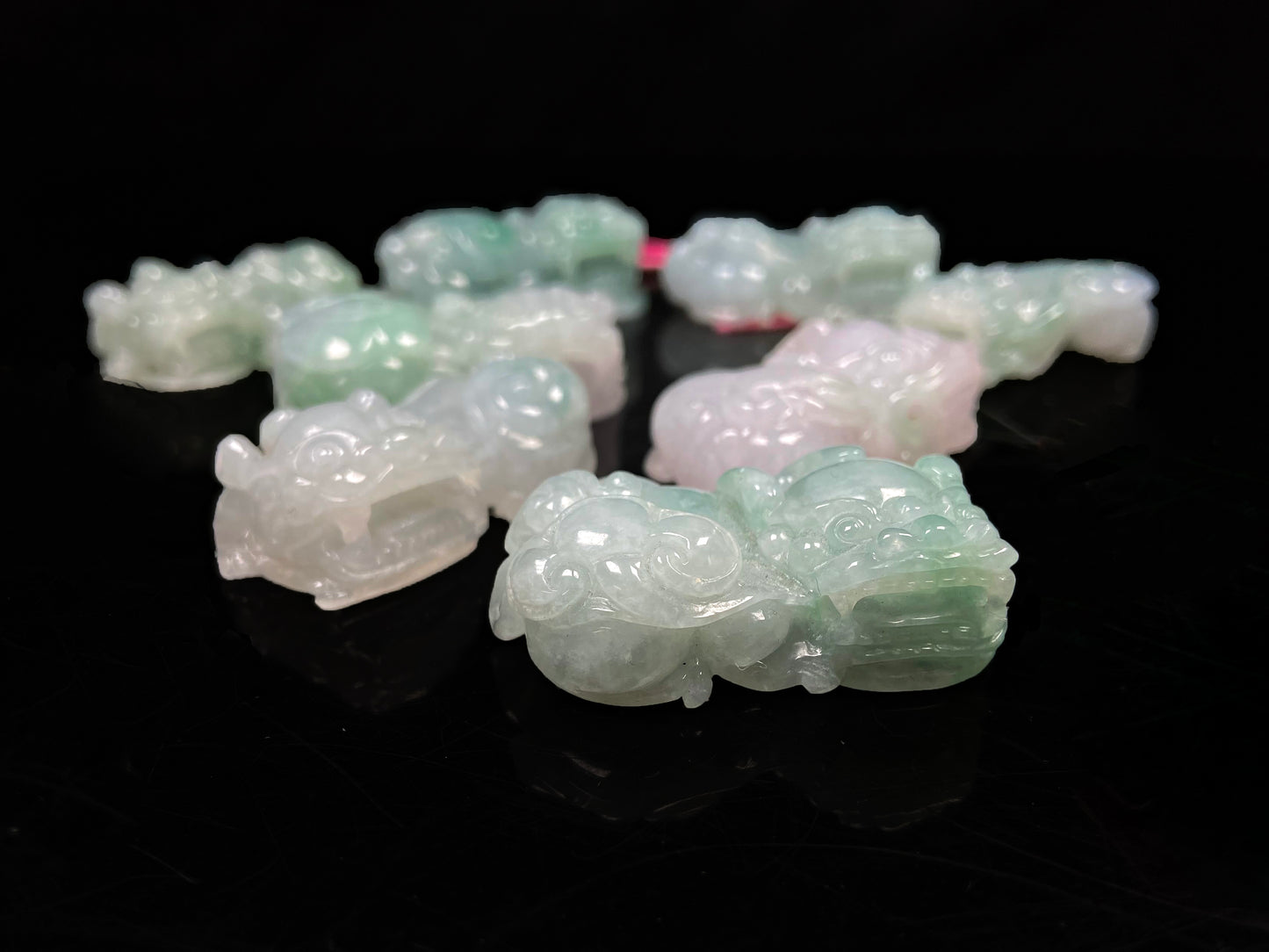 A white green Overlord Pixiu loose jadeite group.