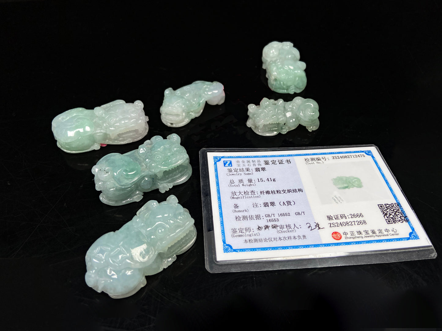 A white green Overlord Pixiu loose jadeite group.