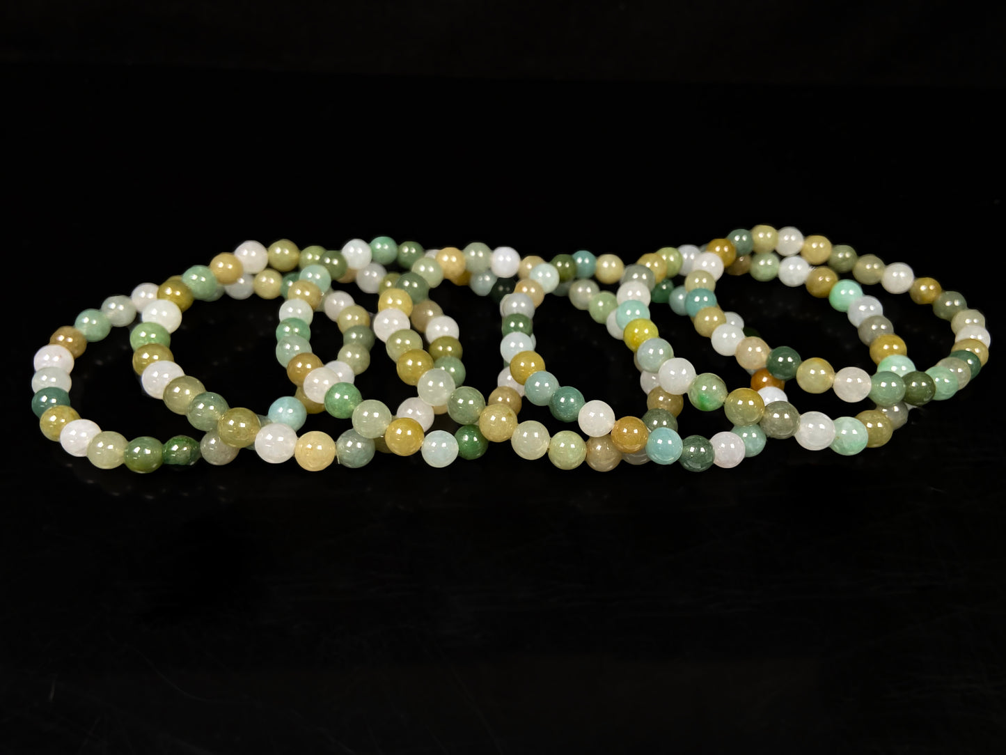 A pastel green mix jadeite beads bracelet group.