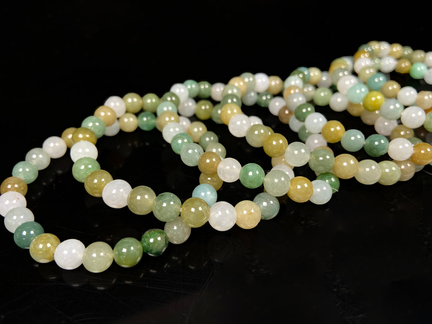 A pastel green mix jadeite beads bracelet group.