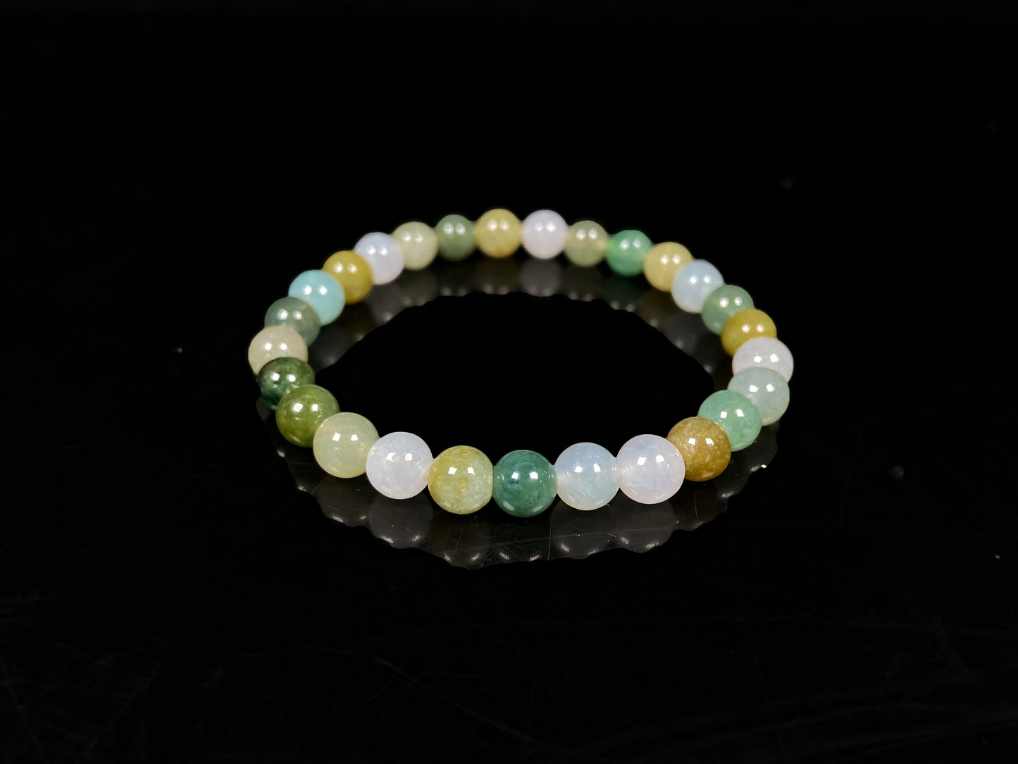 A pastel green mix jadeite beads bracelet.