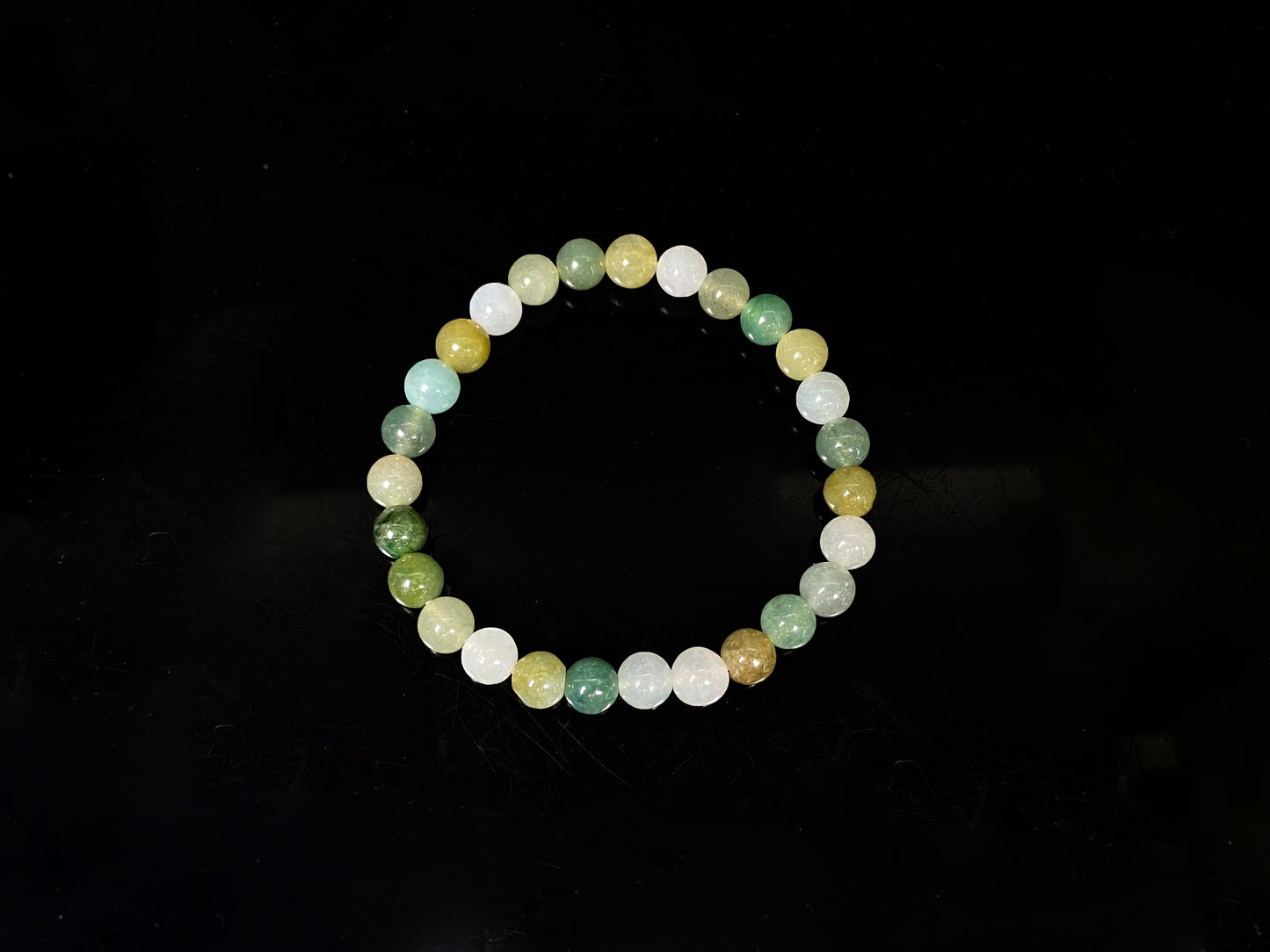 A pastel green mix jadeite beads bracelet.