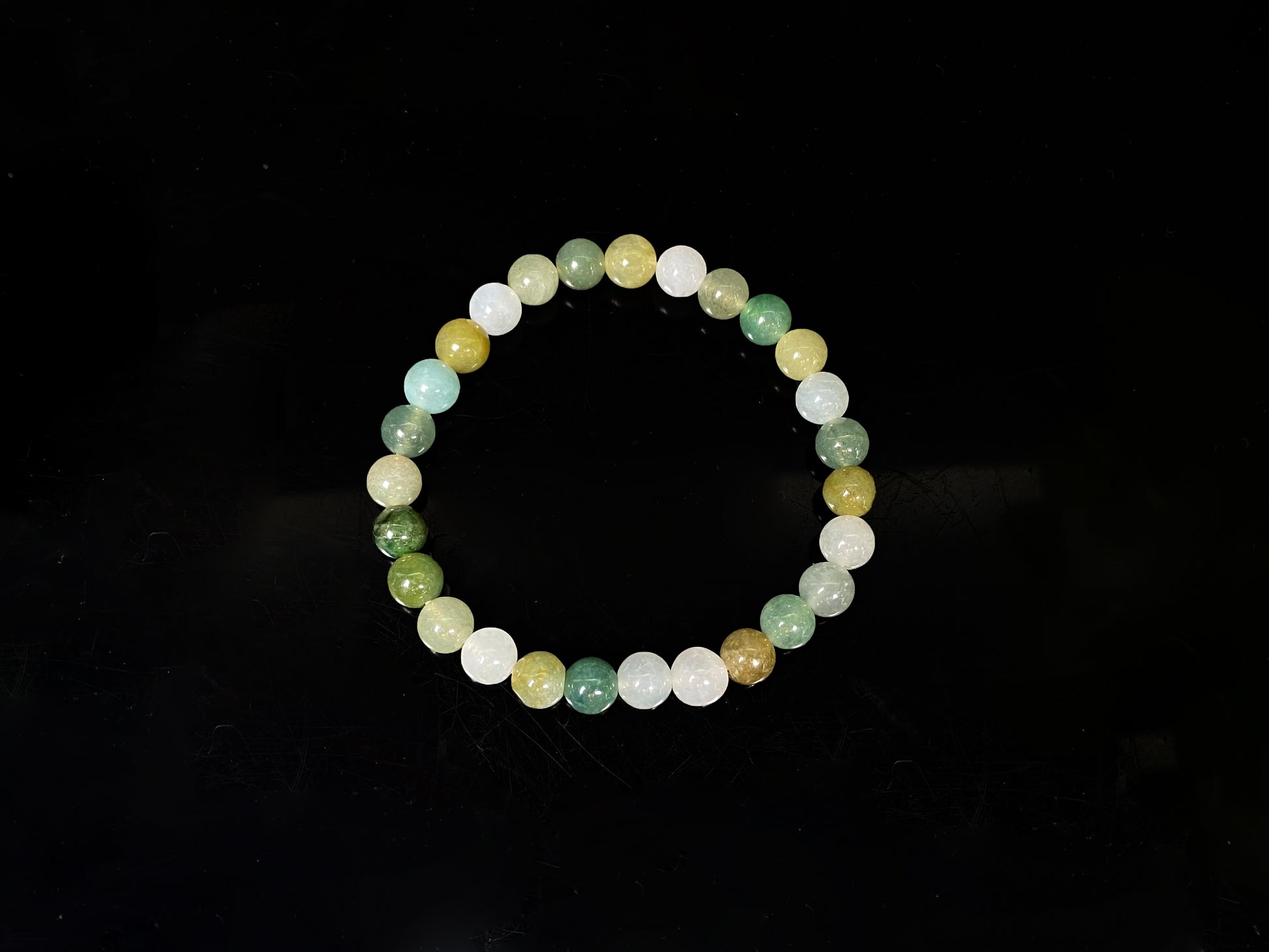 A pastel green mix jadeite beads bracelet.