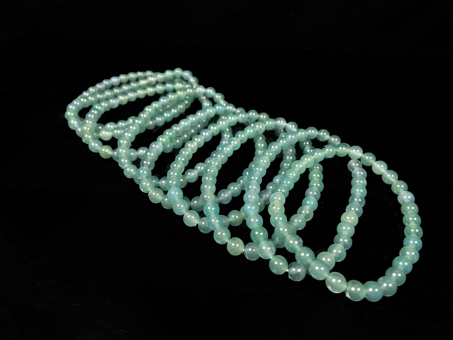 A icy blue repose jadeite beads bracelet group.
