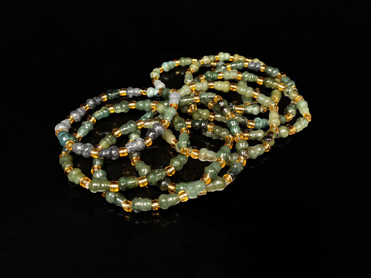 A green hue gourd beads jadeite beads bracelet group.