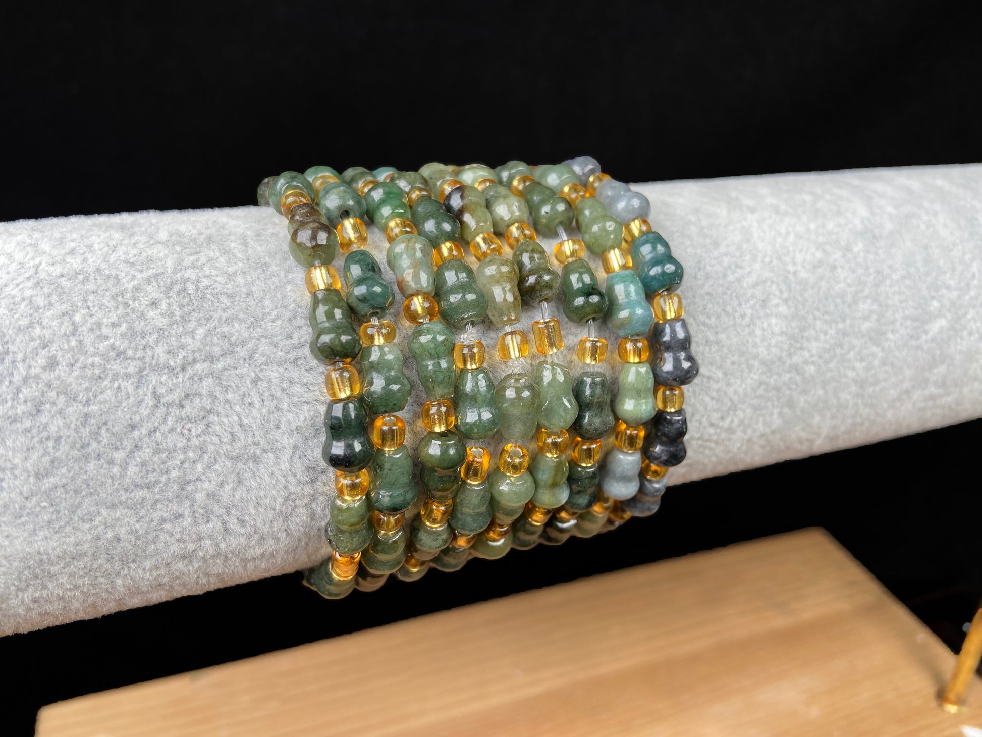 A green hue gourd beads jadeite beads bracelet group.