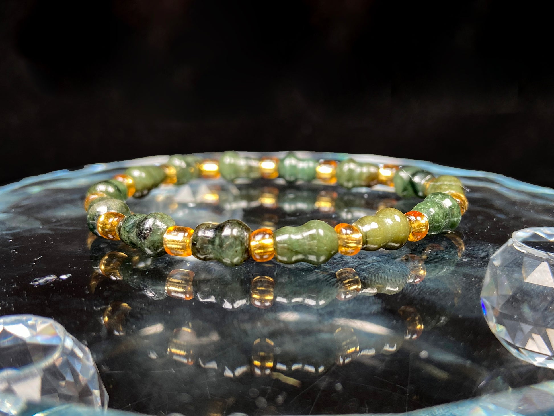 A green hue gourd beads jadeite beads bracelet group.