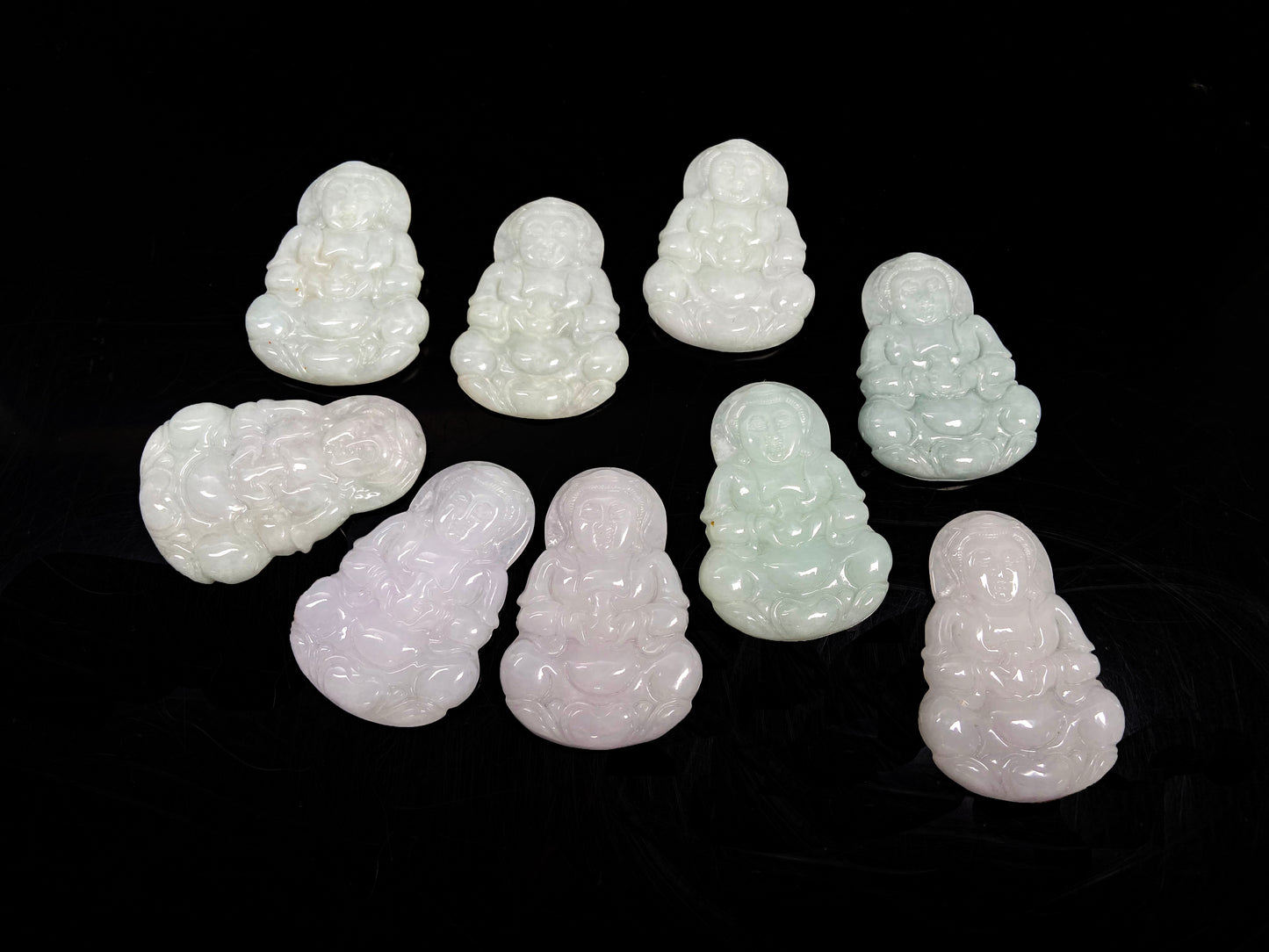 A purple green Guanyin blessing loose jadeite group.
