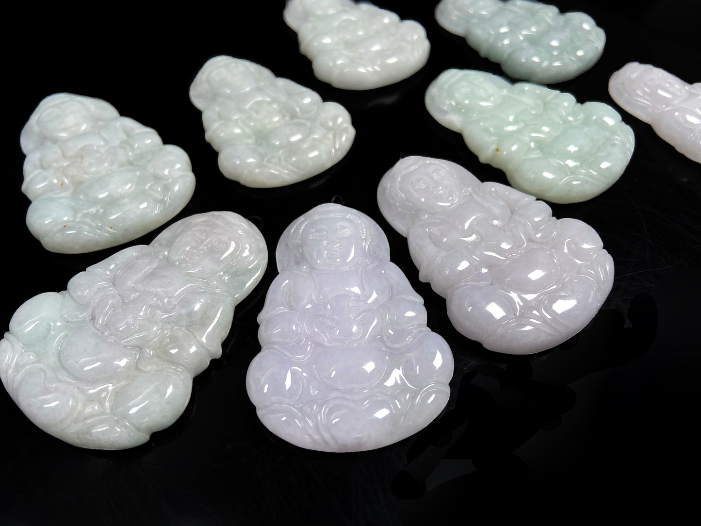 A purple green Guanyin blessing loose jadeite group.