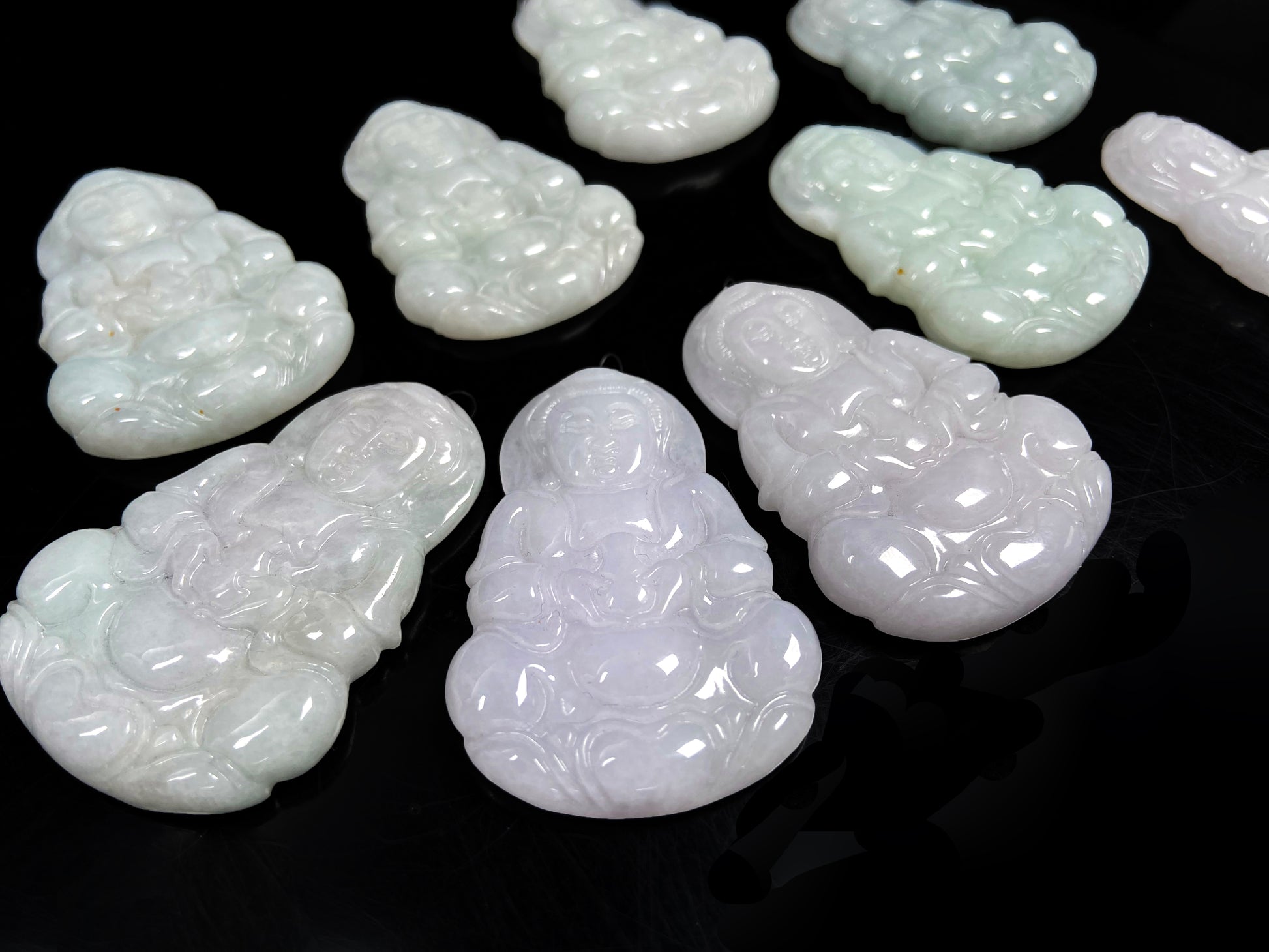 A purple green Guanyin blessing loose jadeite group.
