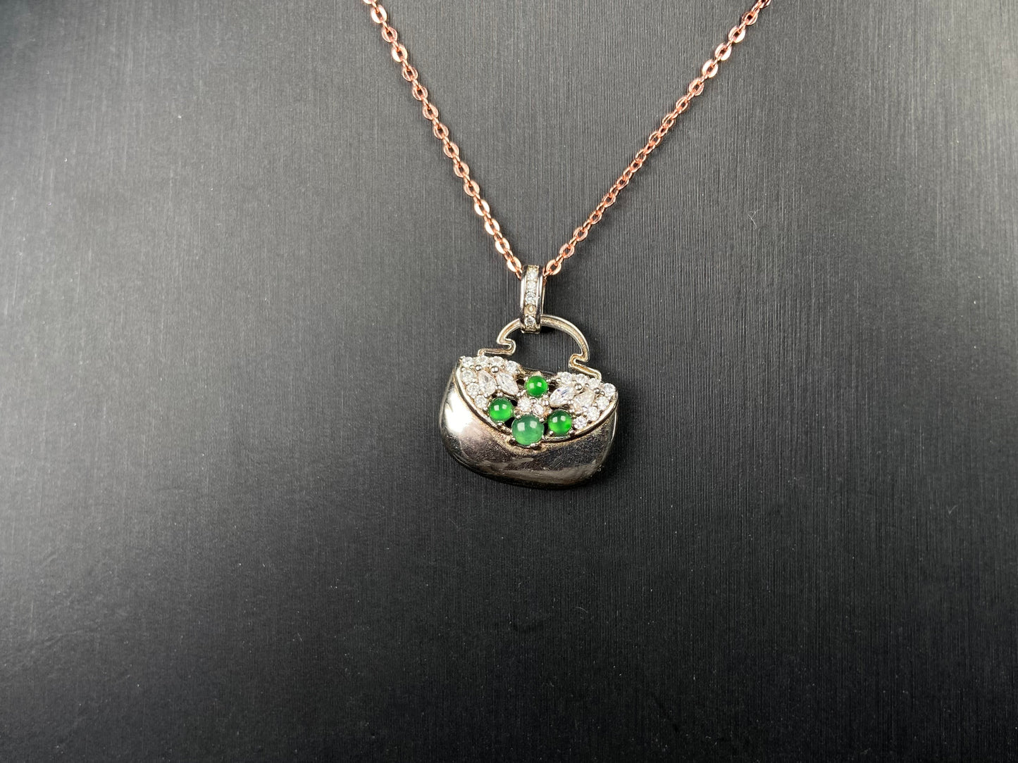 A green bead diamond bag jadeite pendant.