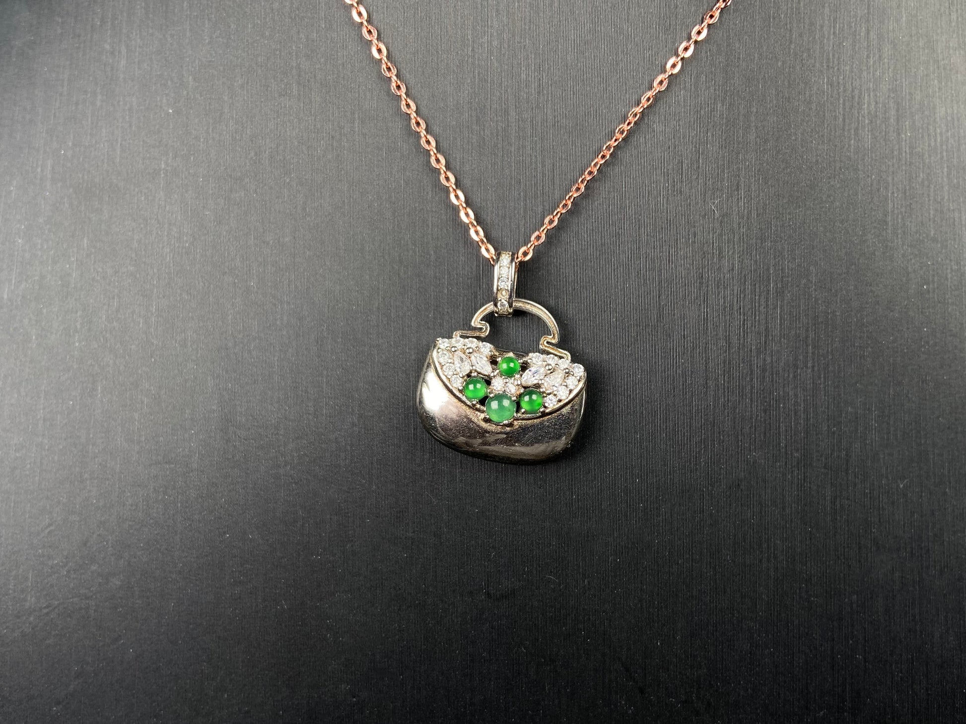 A green bead diamond bag jadeite pendant.