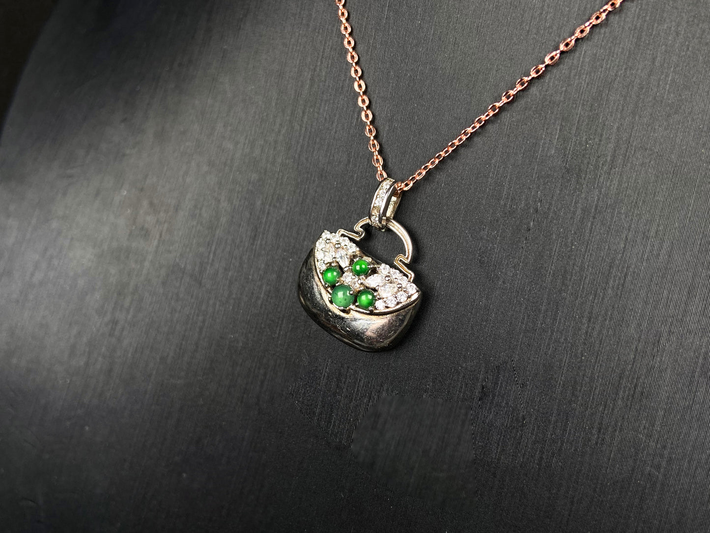 A green bead diamond bag jadeite pendant.