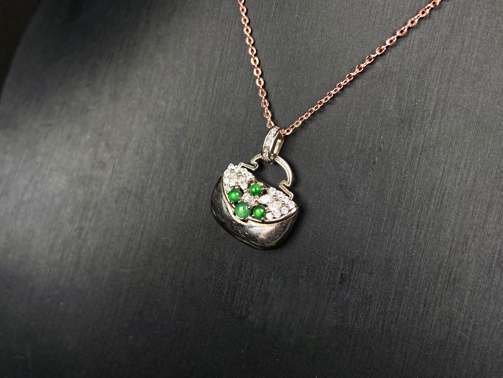 A green bead diamond bag jadeite pendant.