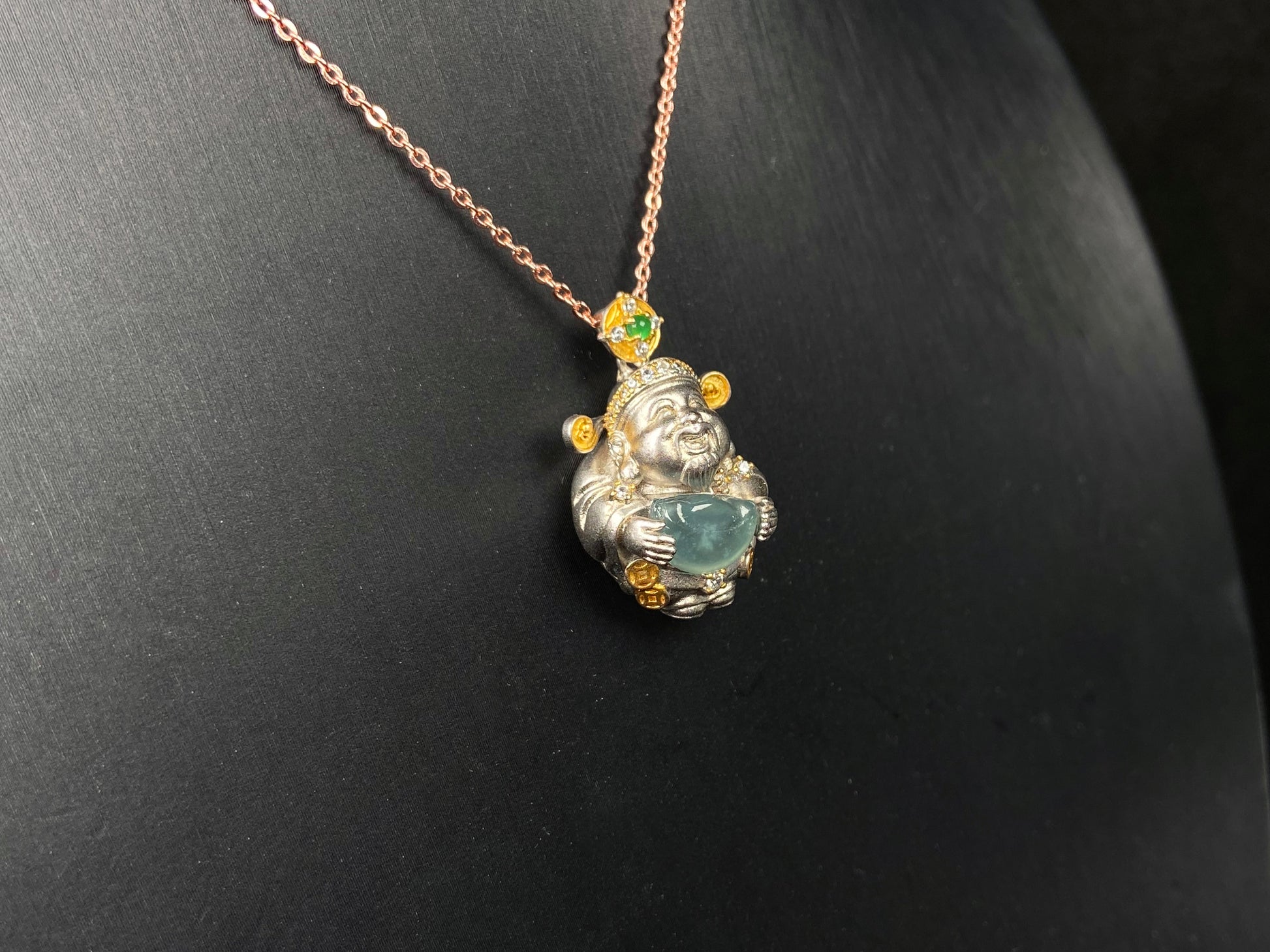 A aqua ingot fortune god jadeite pendant.
