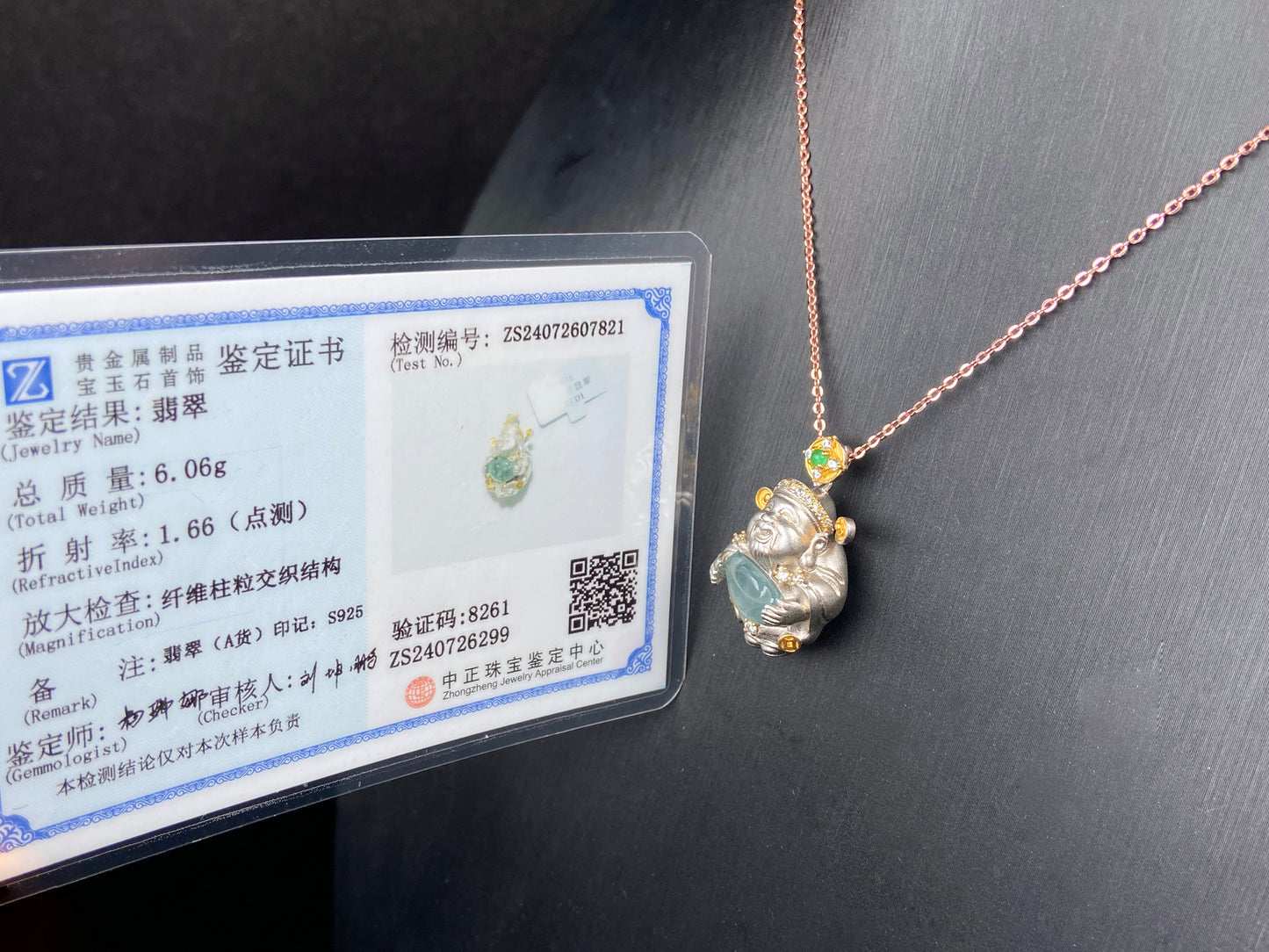 A aqua ingot fortune god jadeite pendant.