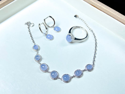 This is a purple jadeite ring, a purple jadeite necklace, and purple jadeite earrings.