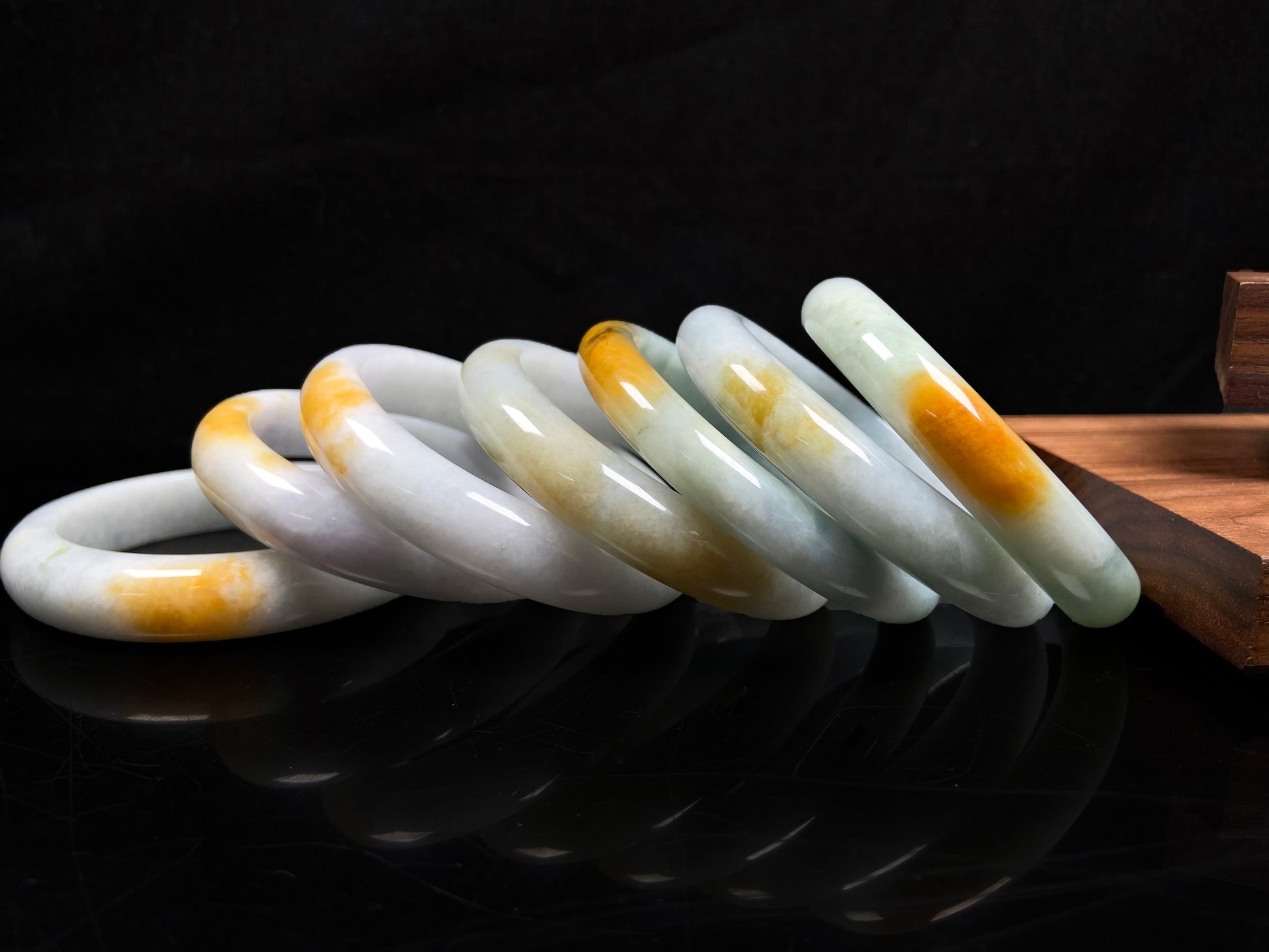 A white and gold jadeite bangle group.