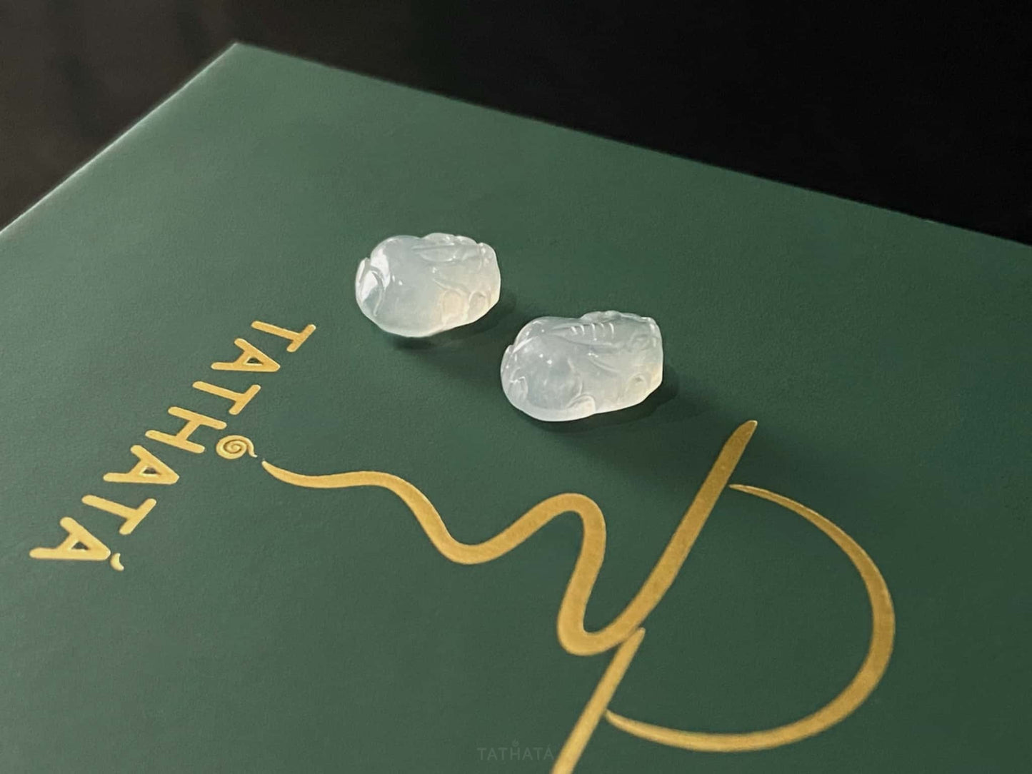 A glacial moonlight Pixiu pair loose jadeite.