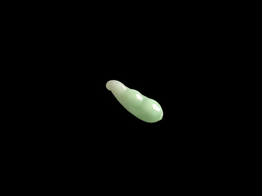 A pale green fortune pod loose jadeite.