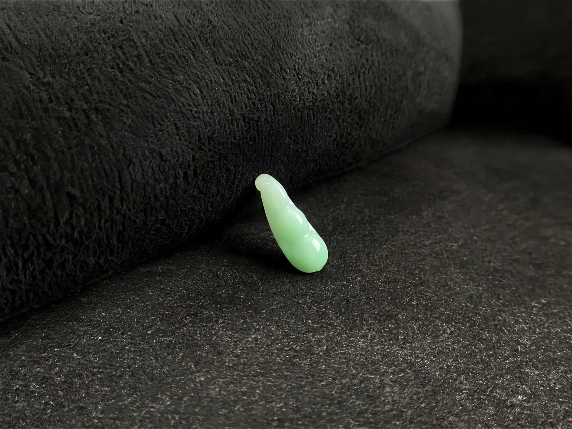 A pale green fortune pod loose jadeite.