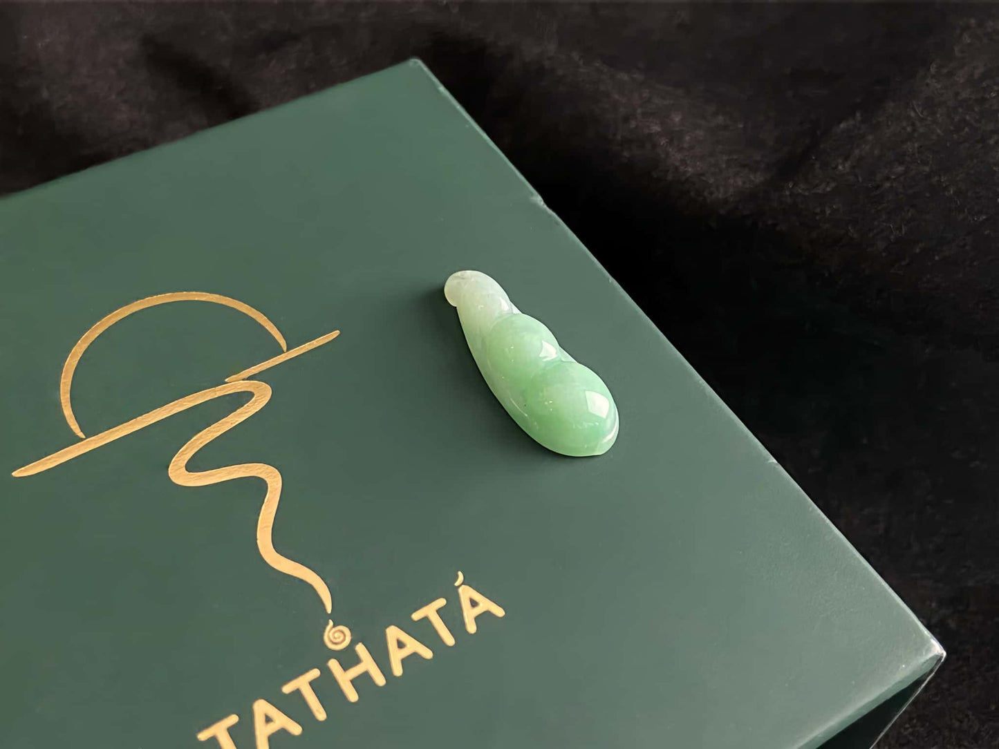 A pale green fortune pod loose jadeite.
