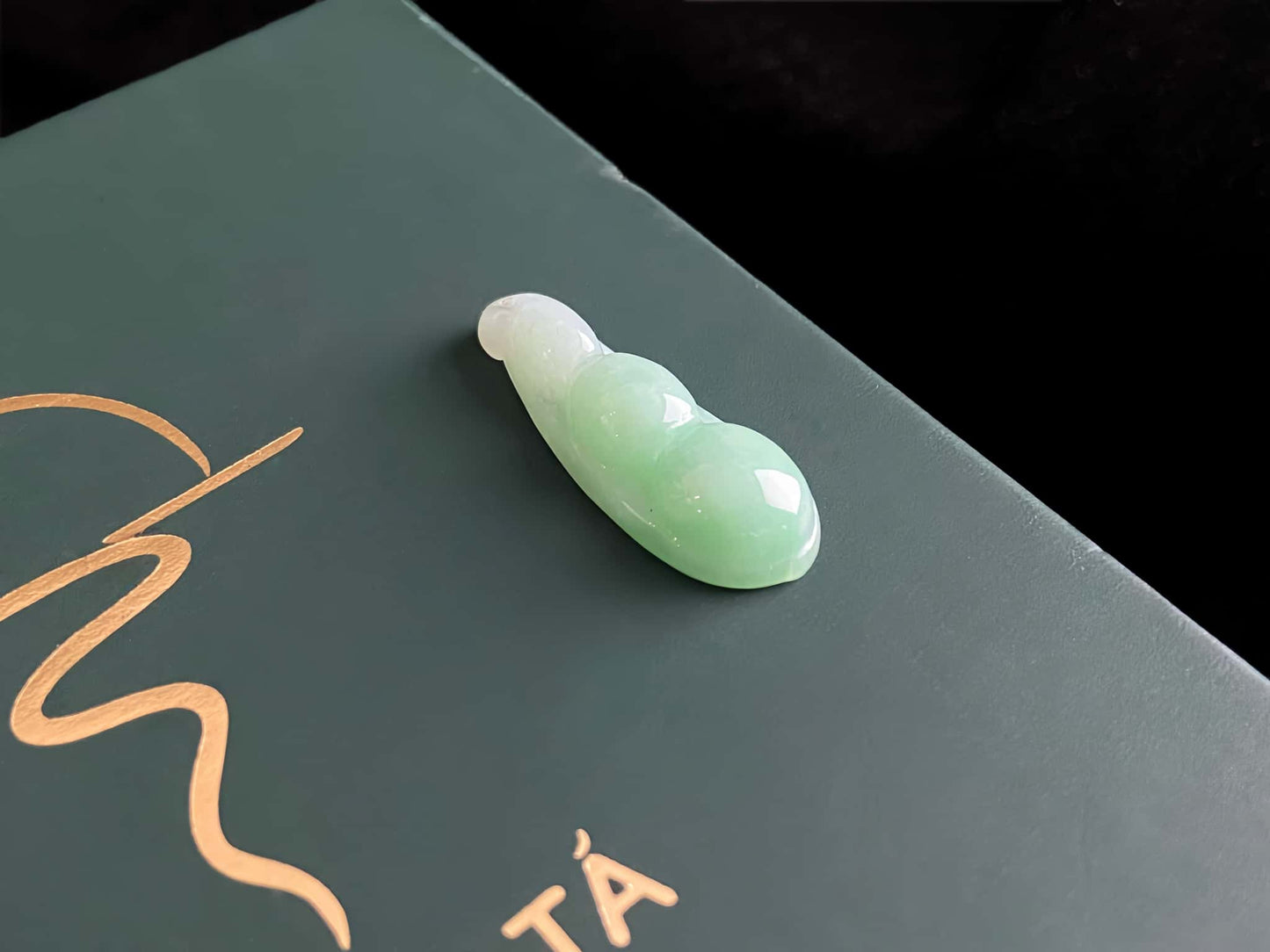 A pale green fortune pod loose jadeite.