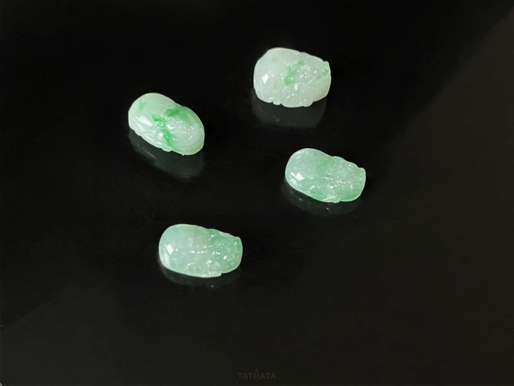 A green dot fortune Pixiu loose jadeite.