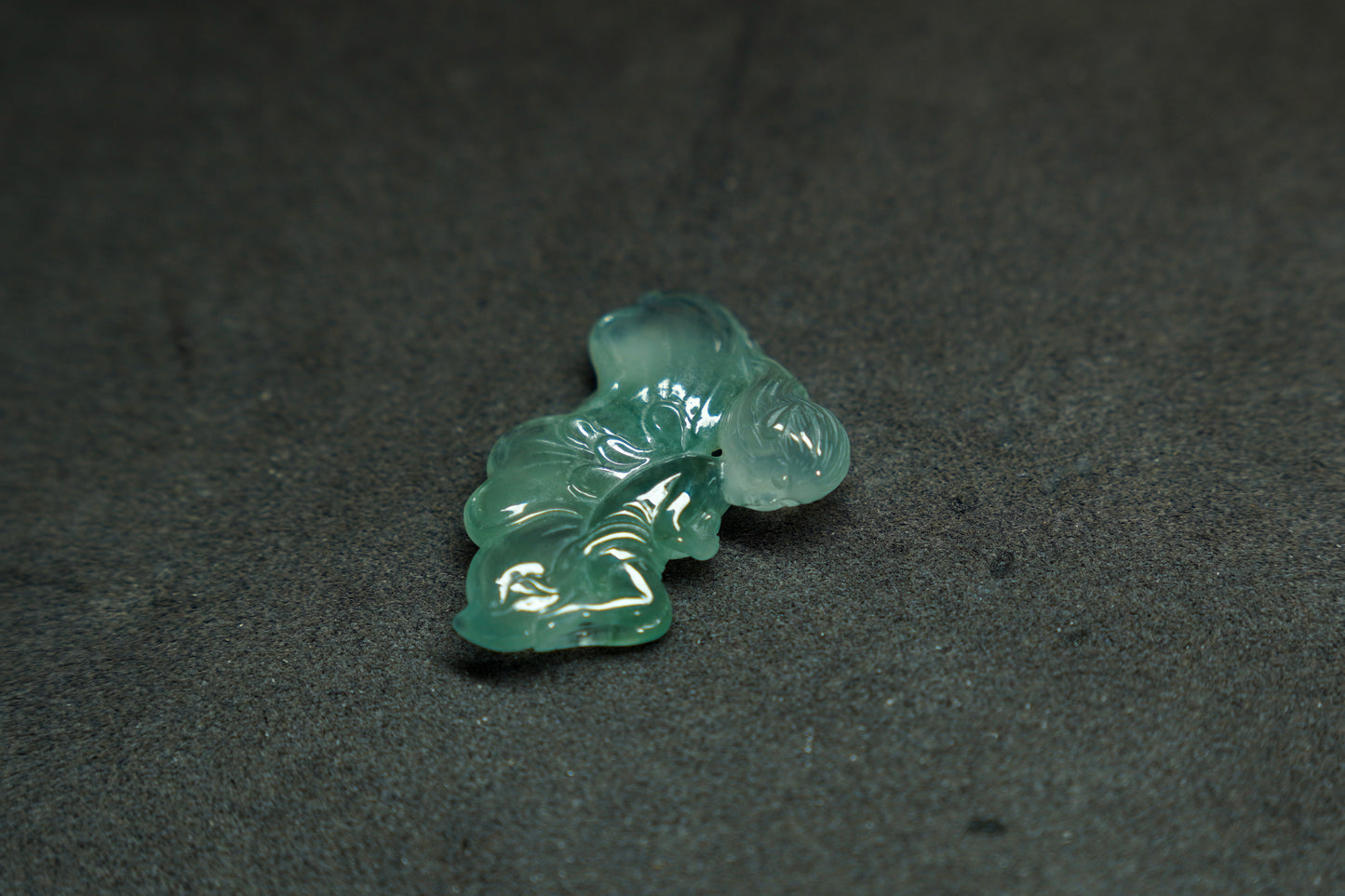 A translucent green jade butterfly maiden, carved with delicate grace.