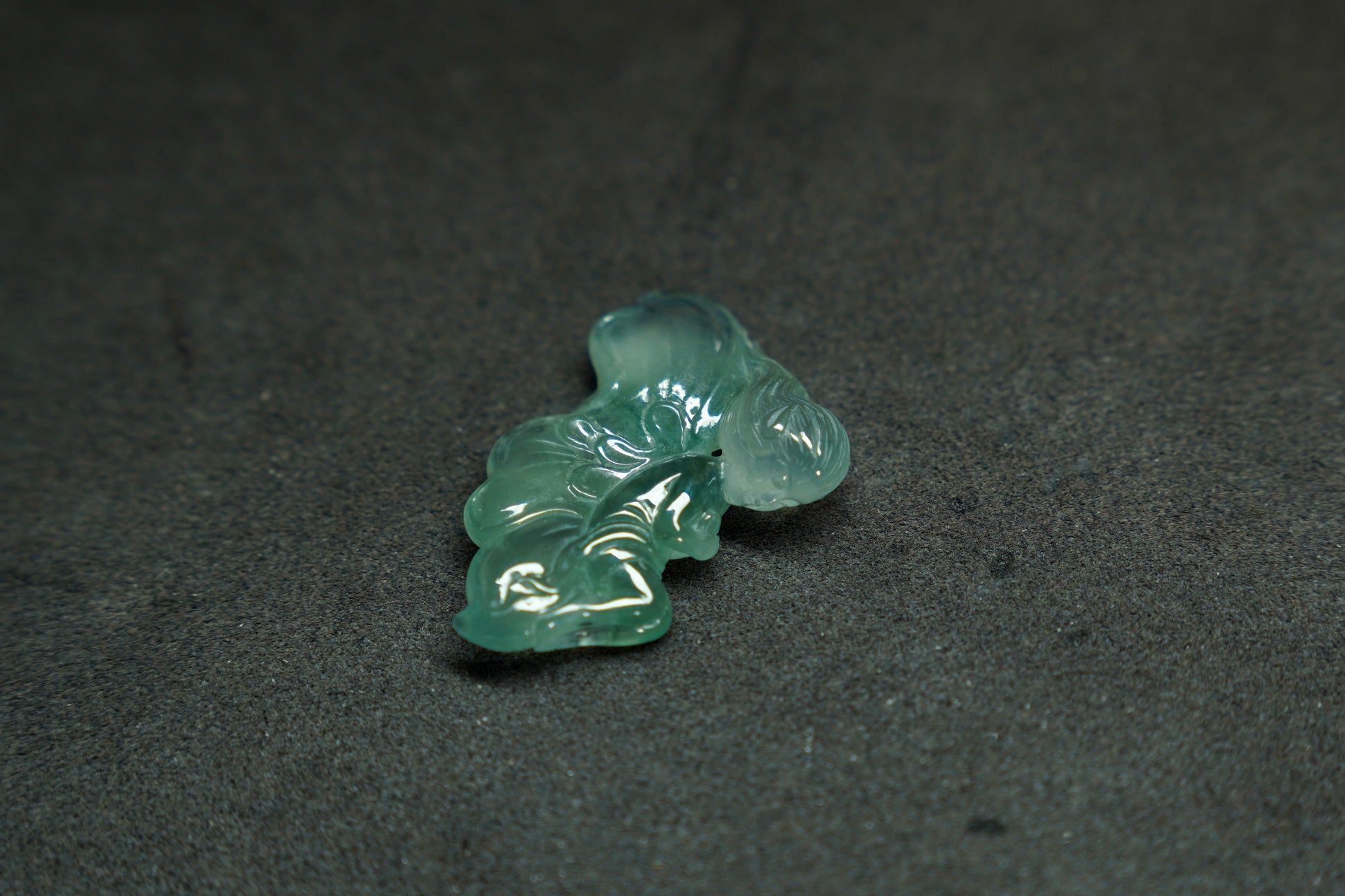 A translucent green jade butterfly maiden, carved with delicate grace.