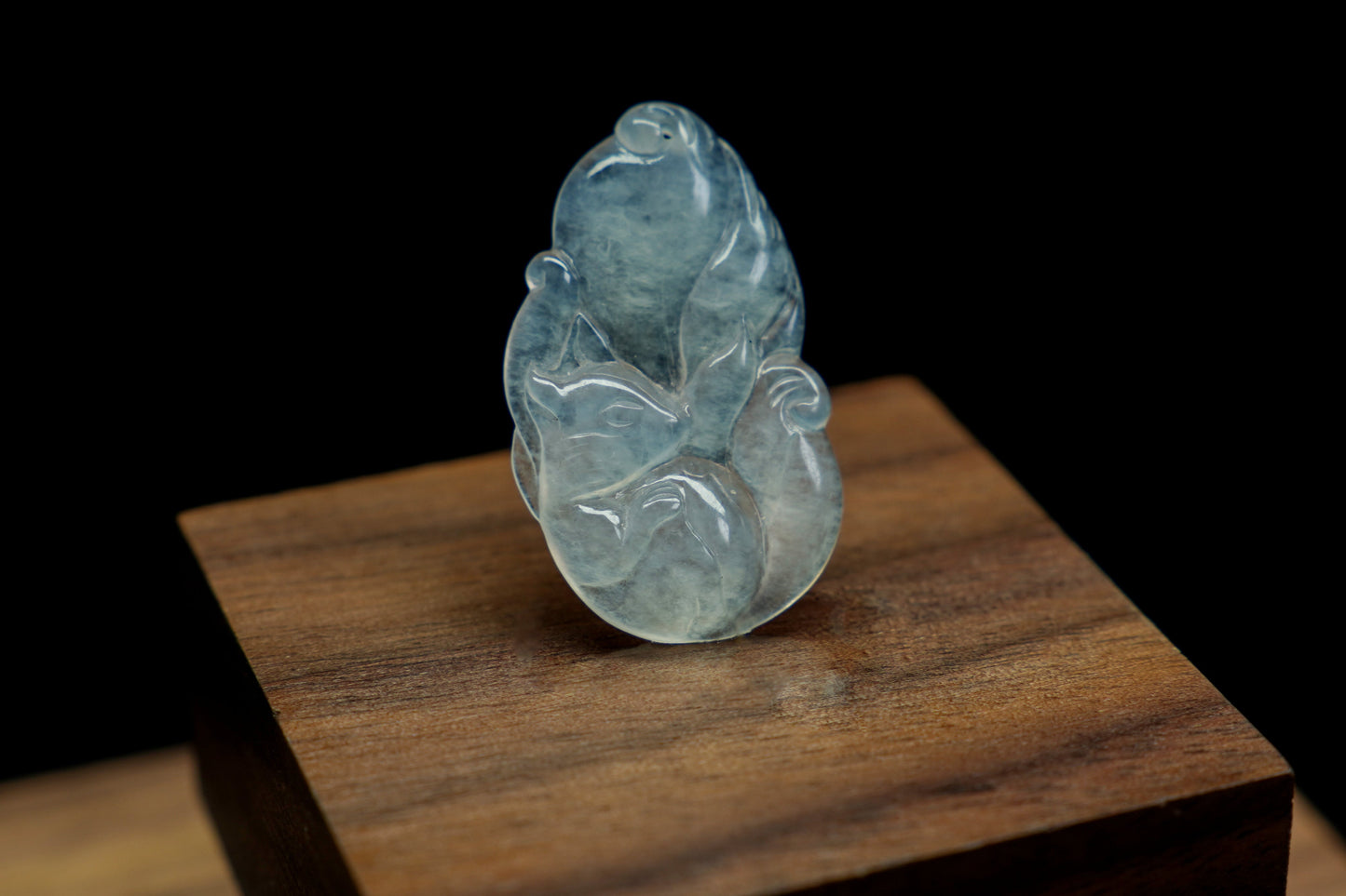 A translucent white jade fox, exuding elegance and charm.