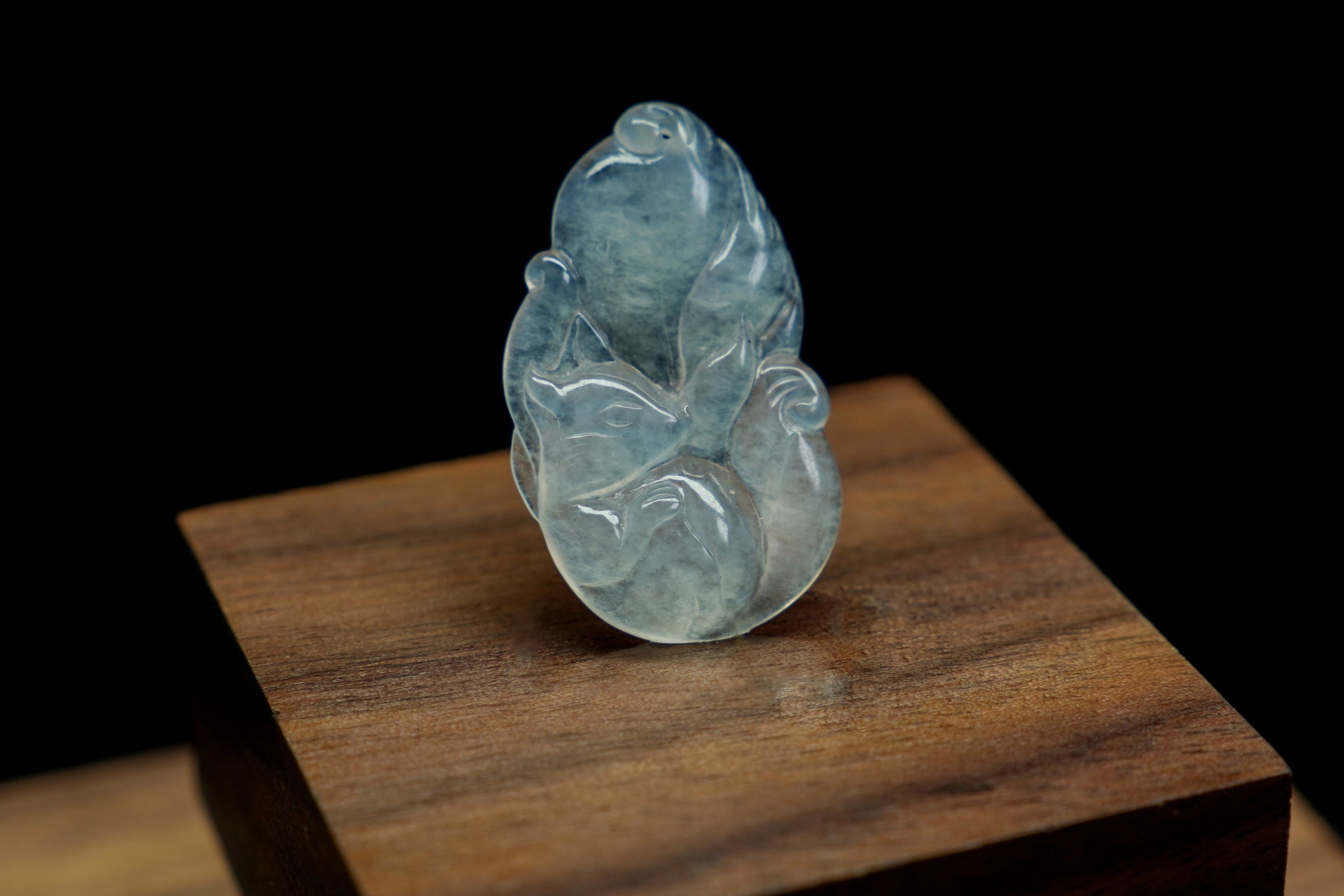 A translucent white jade fox, exuding elegance and charm.