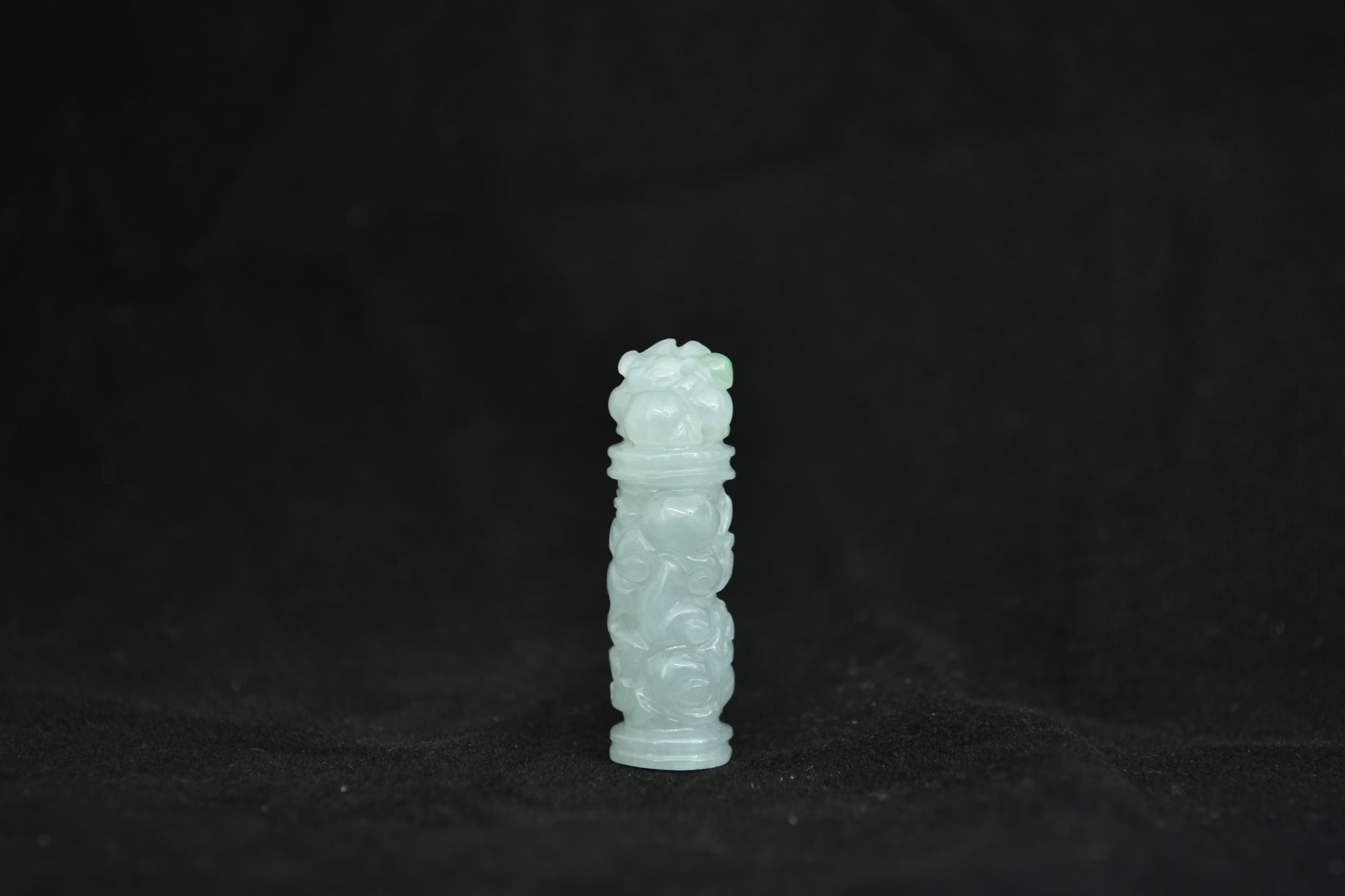 A milky white jade column, inspired by the traditional Chinese ornamental pillar.