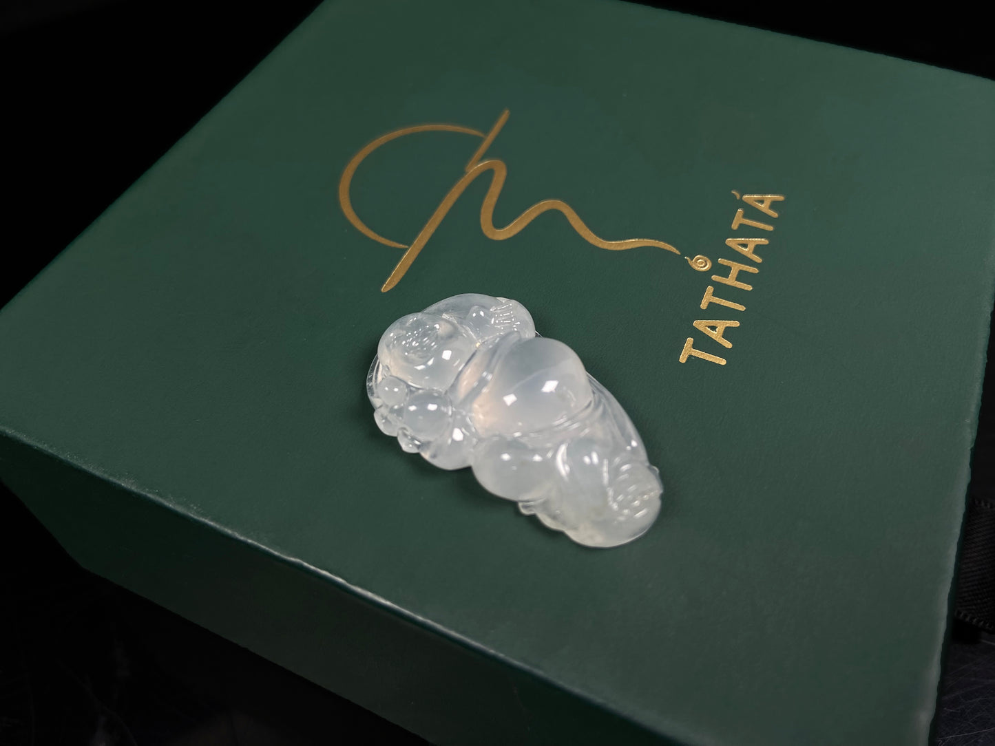 A translucent milky white maitreya buddha loose jadeite.