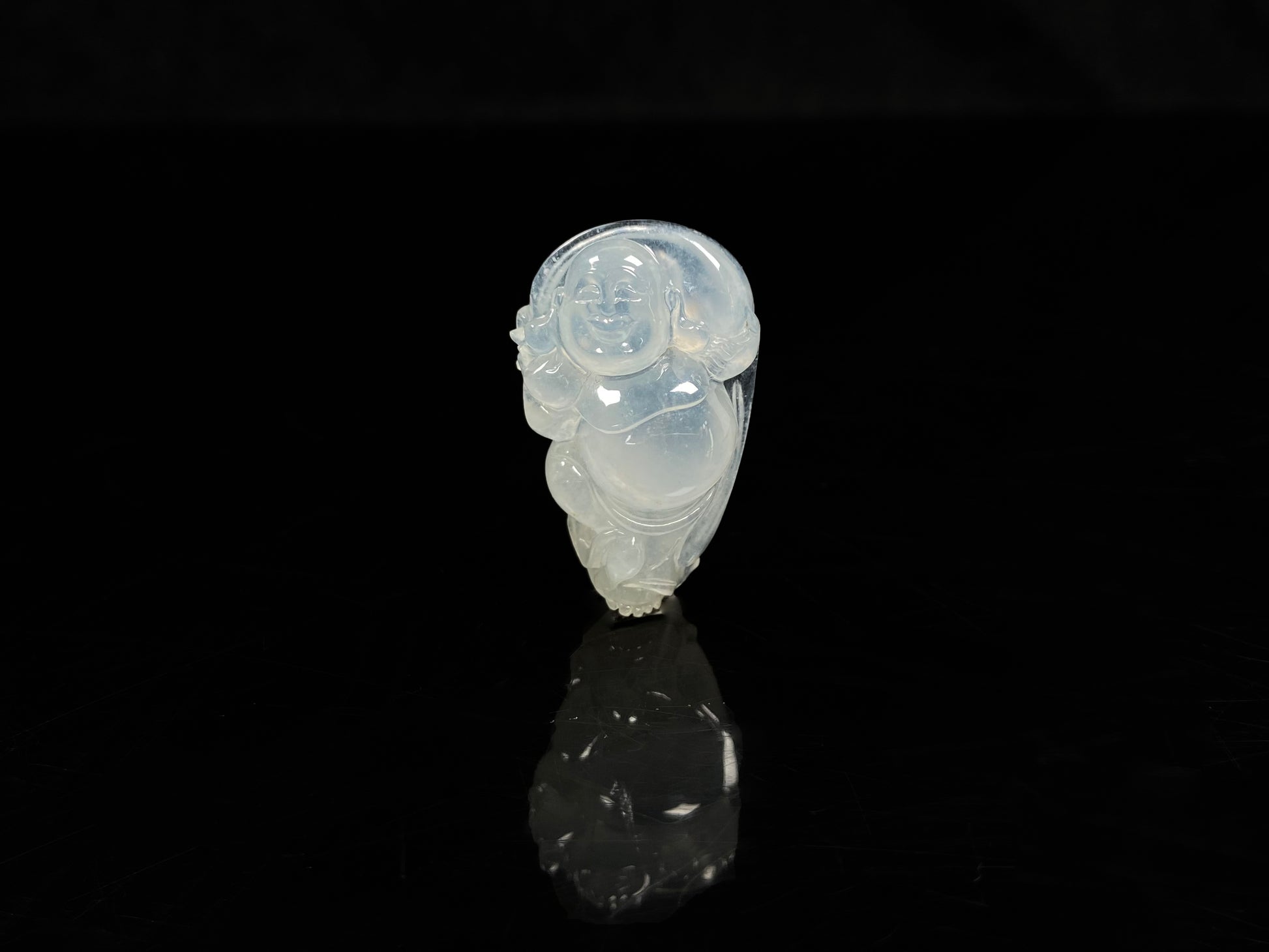 A translucent milky white maitreya buddha loose jadeite.