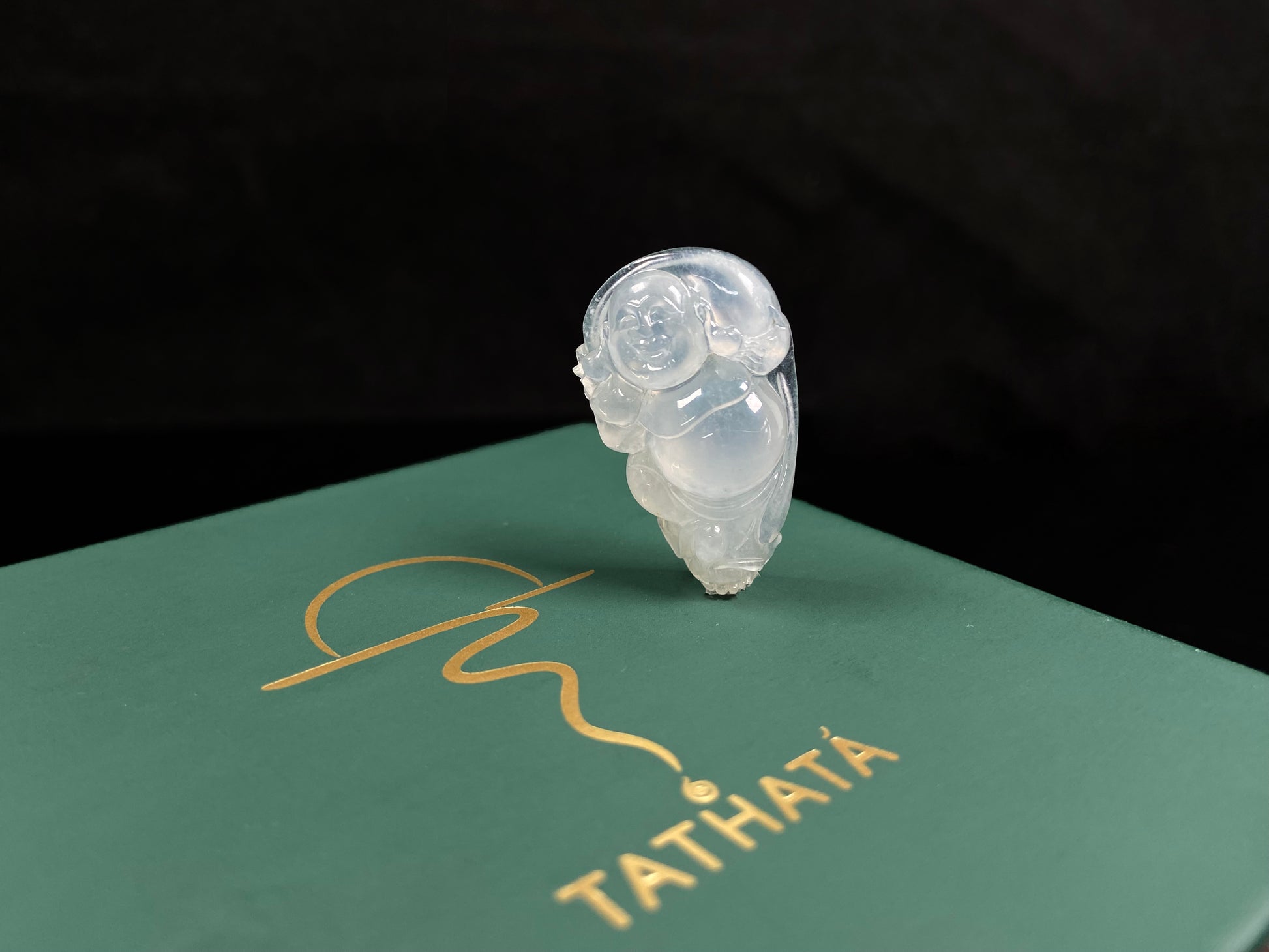 A translucent milky white maitreya buddha loose jadeite.