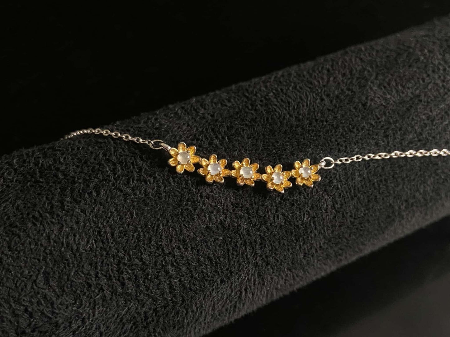 A daisy dew bloom jadeite necklace.