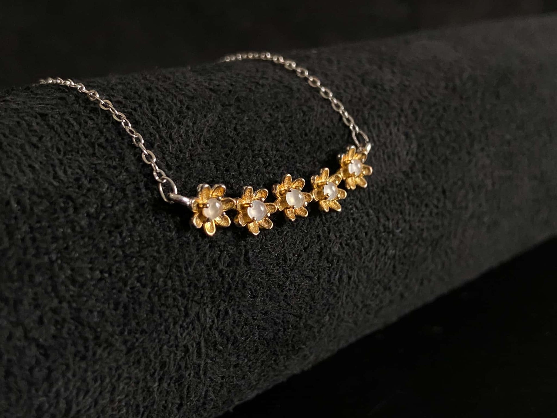 A daisy dew bloom jadeite necklace.