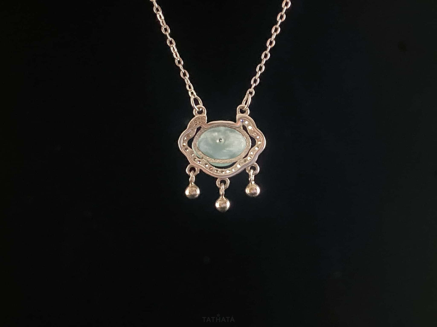 A ice green Ruyi chime jadeite pendant.