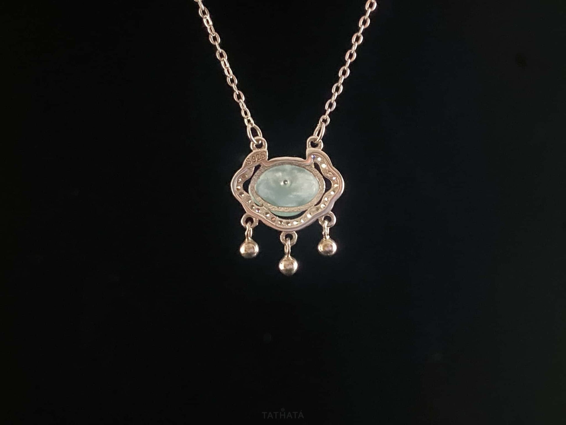 A ice green Ruyi chime jadeite pendant.