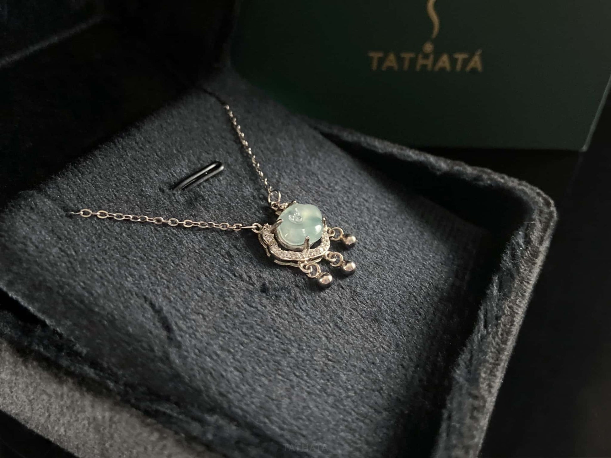 A ice green Ruyi chime jadeite pendant.